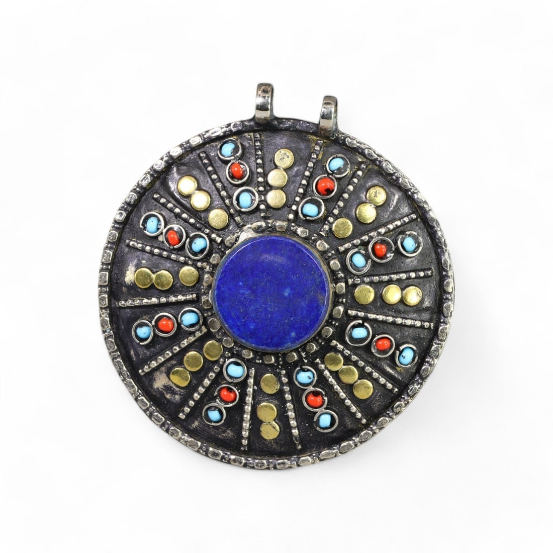 CENTRAL ASIAN: Silver Solar Medallion Pendant with Lapis and Gilded Accents, 20th Cent (43g, 6.5cm): This stunning Central Asian silver pendant, known as the "Solar Medallion," features a radiant design centered around a bold lapis lazuli stone. The medallion is adorned with turquoise and coral inlay