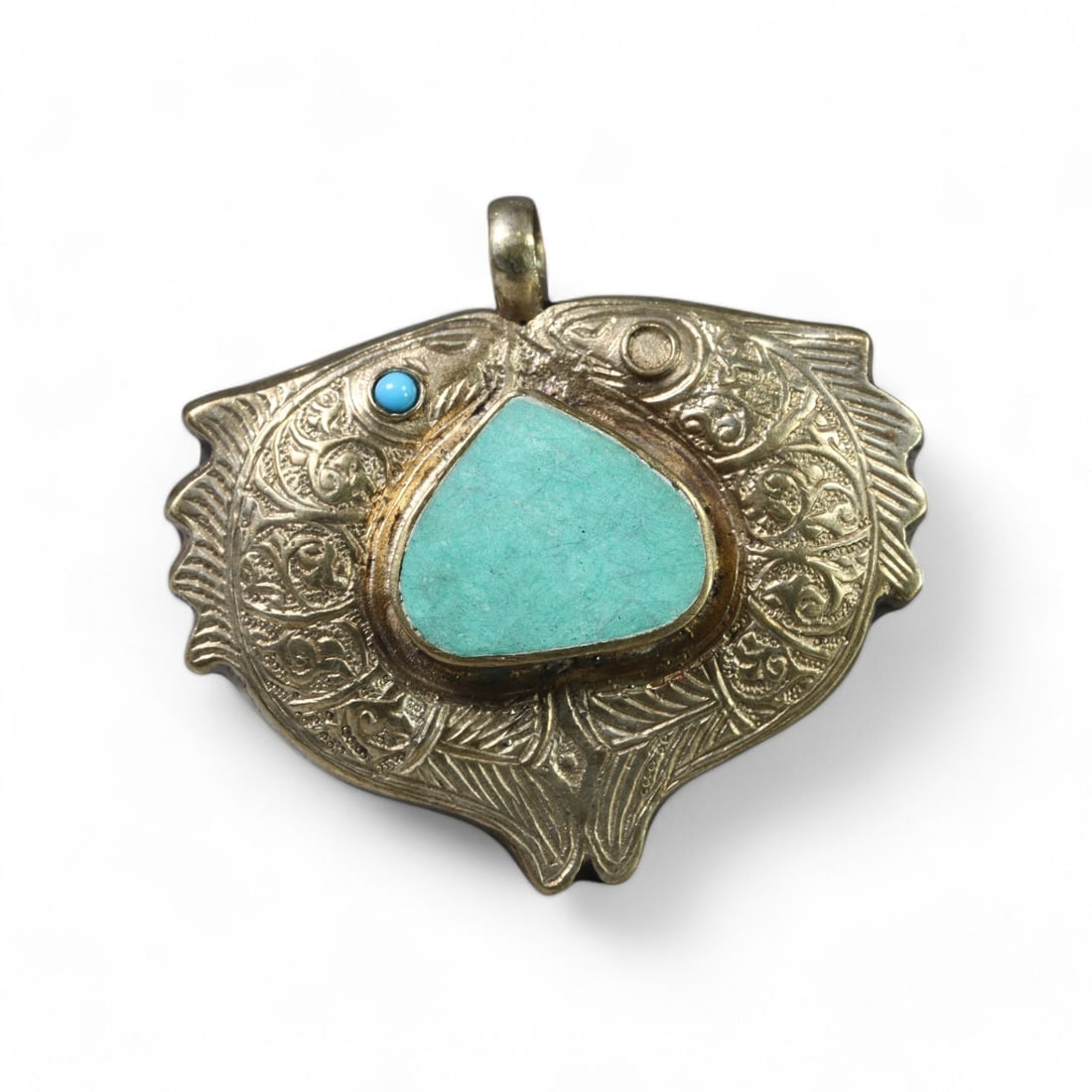 HIMALAYAN: Silver "Twin Fish Turquoise" Pendant, 20th Century (37g, 6x4cm): This exquisite Himalayan silver pendant, known as the "Twin Fish Turquoise," features an intricately engraved twin fish design symbolizing harmony and prosperity. At its center is a vibrant triangular