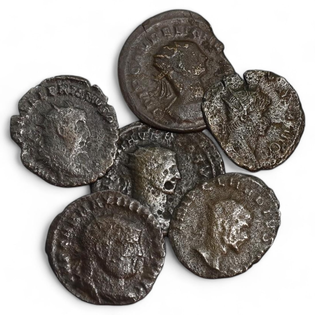 ROMAN EMPIRE: Lot of 6 Silvered Bronze Antoniniani, 3rd Century AD (12g, 17-23mm): This lot features 6 silvered bronze antoniniani, dating to the 3rd century AD, with diameters ranging from 17mm to 23mm and a total weight of 12g. The coins highlight the radiate busts of various empe
