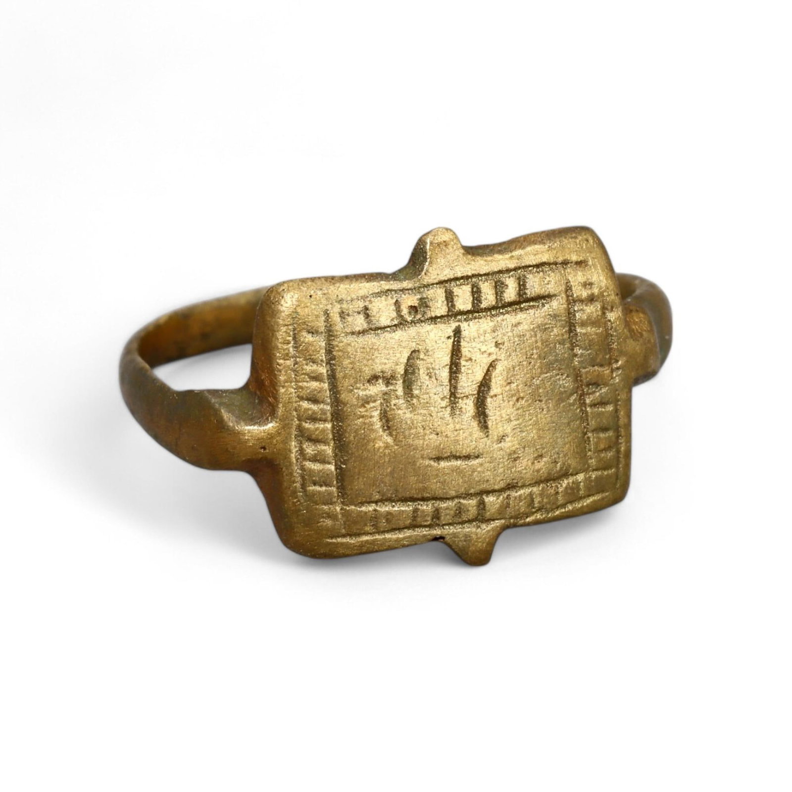 VIKING ERA: Gold-Gilt Signet Ring with Boat Motif, Circa 9th-11th Century CE (3g): This exceptional Viking-era gold-gilt signet ring features a rectangular bezel engraved with a stylized boat motif, a powerful symbol of Viking seafaring culture and exploration. Weighing 3g and profe