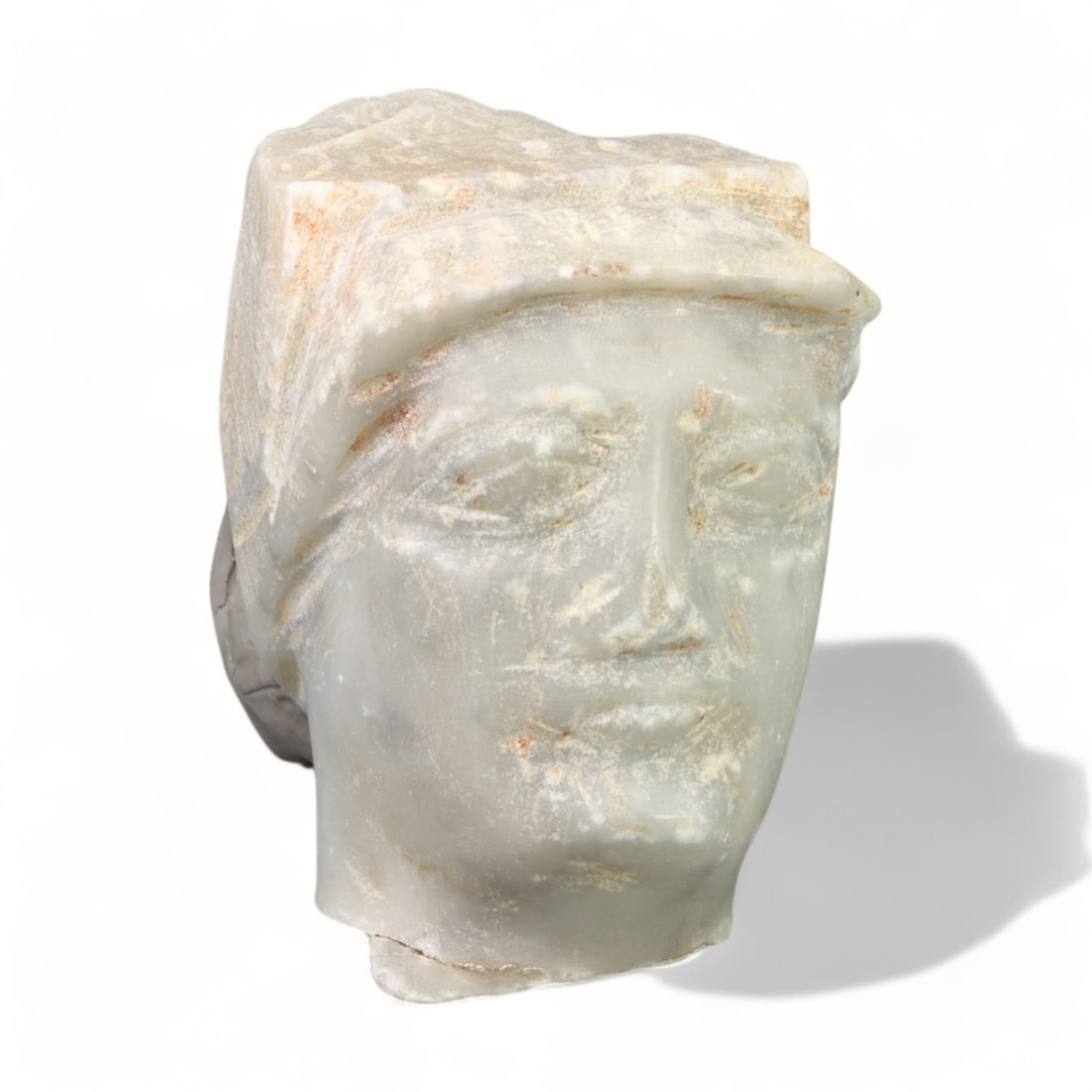RENAISSANCE ERA: Marble Bust Fragment with Cap, 15th-16th Century CE (556g, 8x6cm): This Renaissance-era marble bust fragment, weighing 556 grams and measuring 8x6 cm, features a finely carved face adorned with a simple cap. The restrained detailing of the facial features and headwea