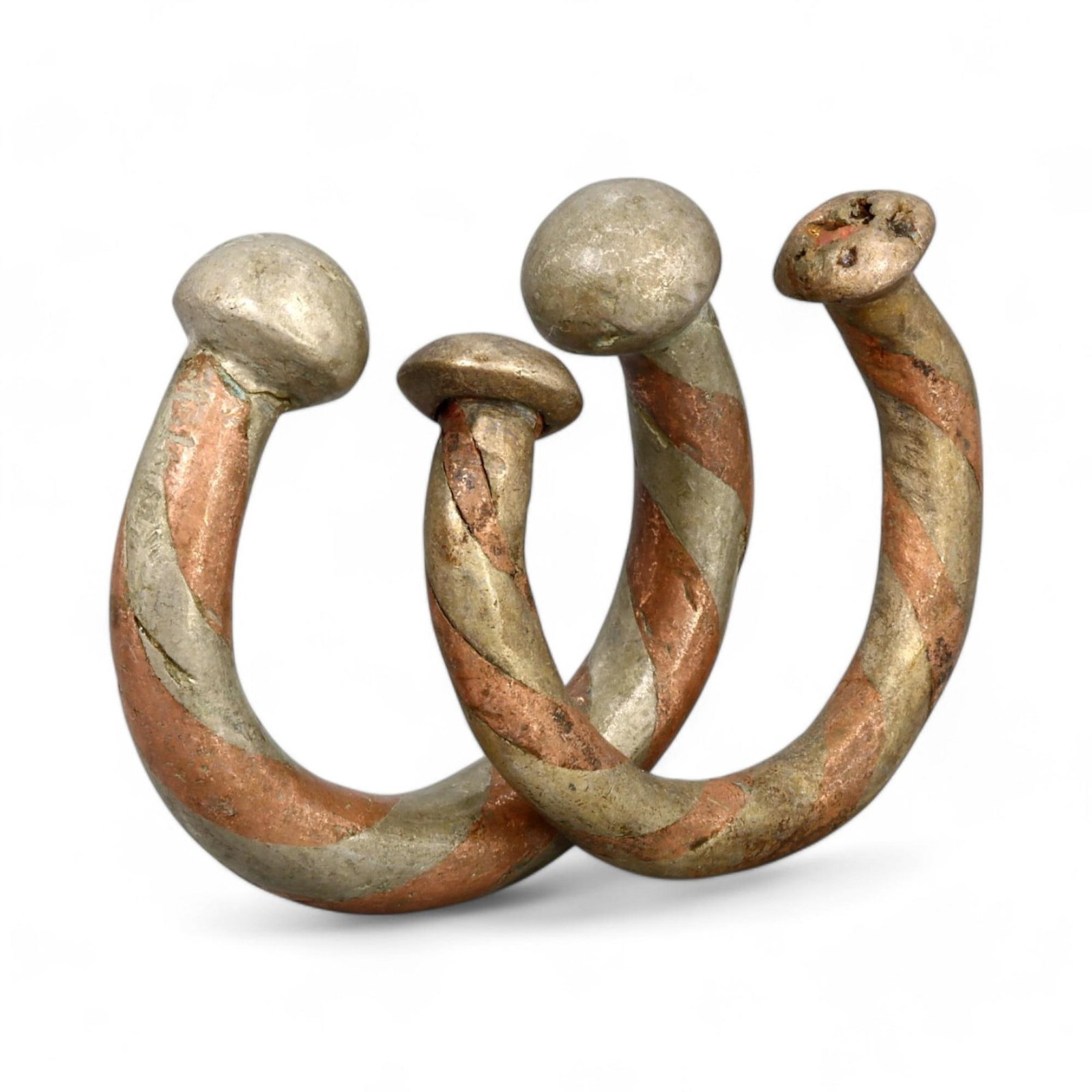 AFRICAN TRADITIONAL: Pair of Copper Alloy Twisted Bracelets, 19th Century CE (270g, 7x1cm): This stunning pair of African copper alloy bracelets, collectively weighing 270 grams and measuring 7x1 cm each, showcases a classic twisted design with alternating copper and silver-toned finishes. T