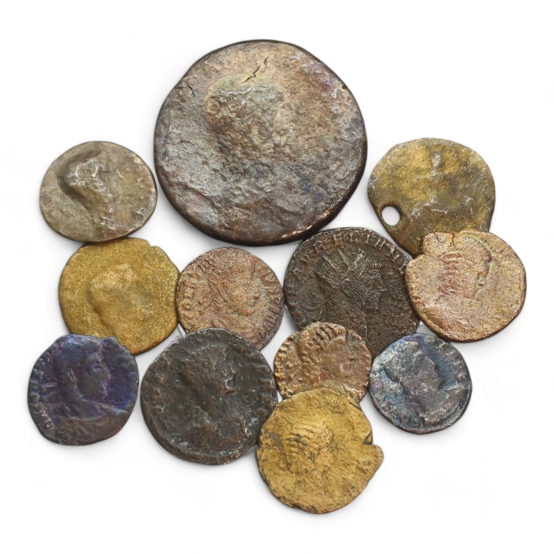 ANCIENT ROMAN EMPIRE: Bronze Coin Lot, Circa 1st-4th Century CE (41g, 15-32mm, 12 Pieces): This collection of ancient Roman coins, offers a glimpse into the economic and cultural fabric of the Roman Empire. The coins feature a variety of designs, including imperial portraits, deities, and m