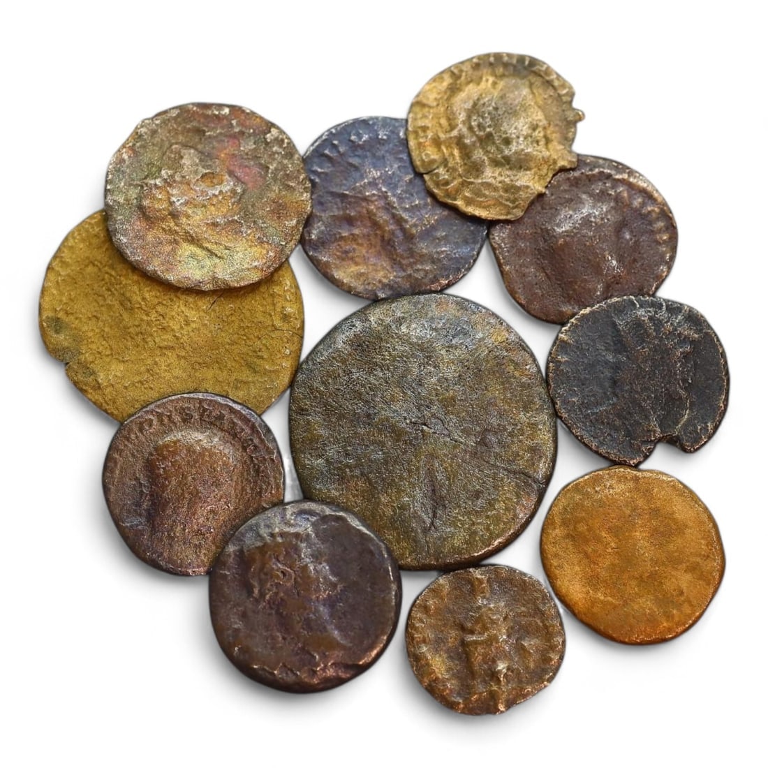ANCIENT ROMAN EMPIRE: Bronze Coin Lot, Circa 1st-4th Century CE (32g, 15-26mm, 11 Pieces): This collection of ancient Roman coins, offers a glimpse into the economic and cultural fabric of the Roman Empire. The coins feature a variety of designs, including imperial portraits, deities, and m