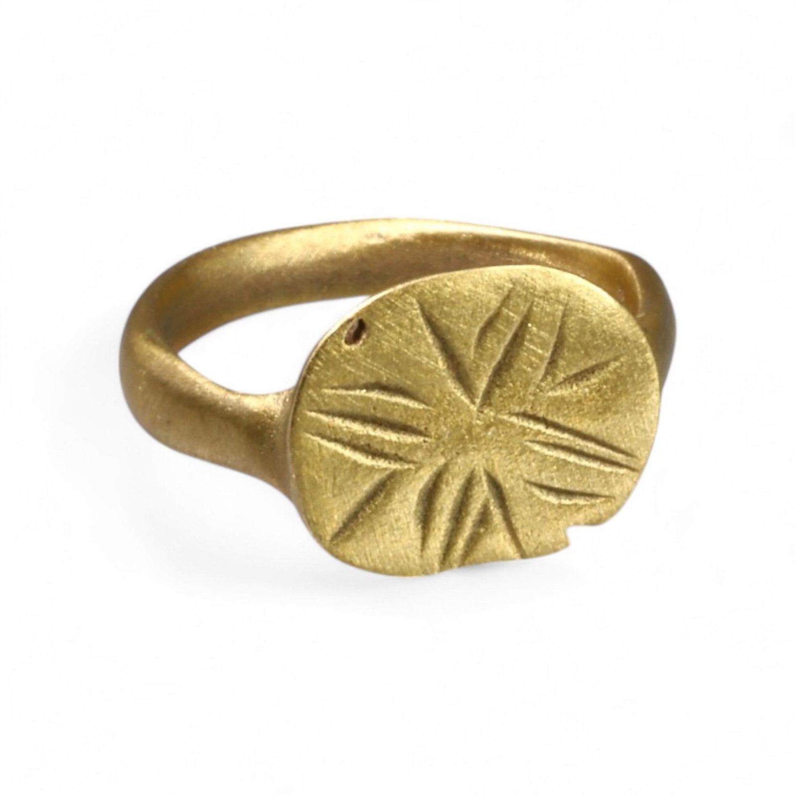 BYZANTINE ERA: Bronze "Radiant Starburst" Signet Ring, 6th-9th Century CE (14mm, 0.8g): This elegant Byzantine-era bronze ring features a flattened oval bezel engraved with a radiant starburst motif, symbolizing light or divine protection, a recurring theme in early Byzantine art and ico