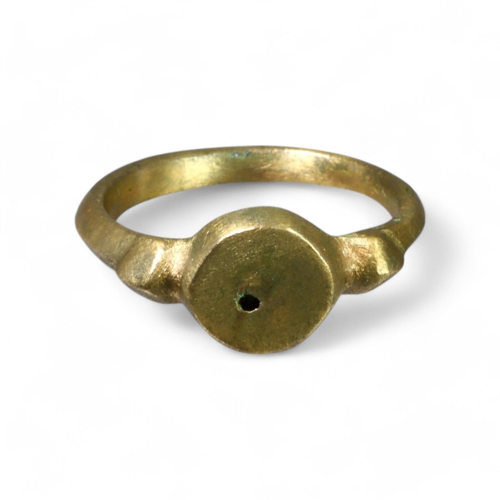 LATE MEDIEVAL: Bronze "Central Point Symbolic" Signet Ring, 14th-15th Century CE ( 5 US, 3g): This Late Medieval bronze ring features a minimalist design with a central circular bezel, engraved with a single punctuated dot at its core. The clean geometric style reflects the era's transition to