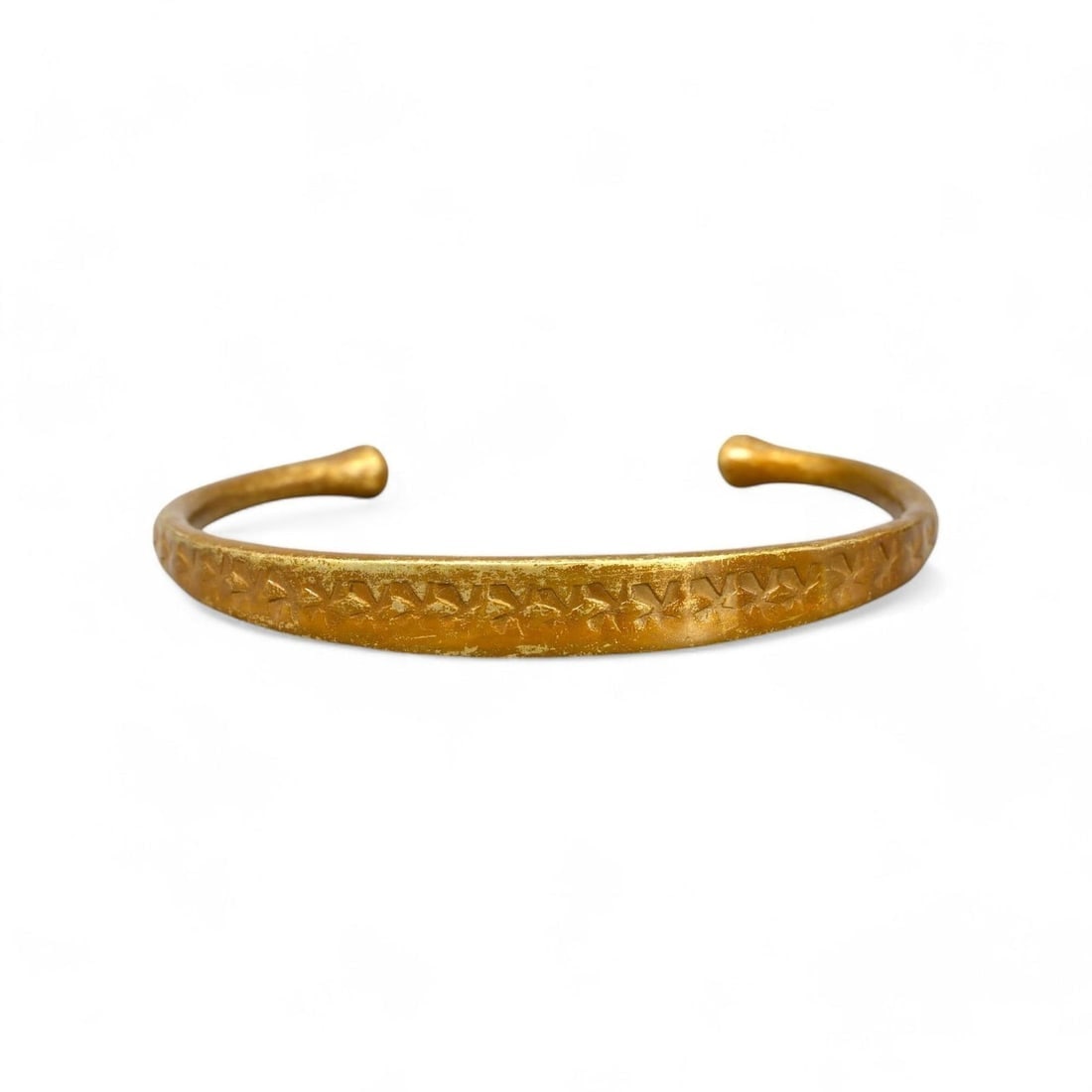 AFRICAN: Gold-Gilt Bronze Bracelet, 19th-20th Century (19g, 6.5cm): This delicate African gold-gilt bronze bracelet, weighing 19g and measuring 6.5cm in diameter, showcases exquisite craftsmanship with an engraved geometric motif running along its surface. Its elegant