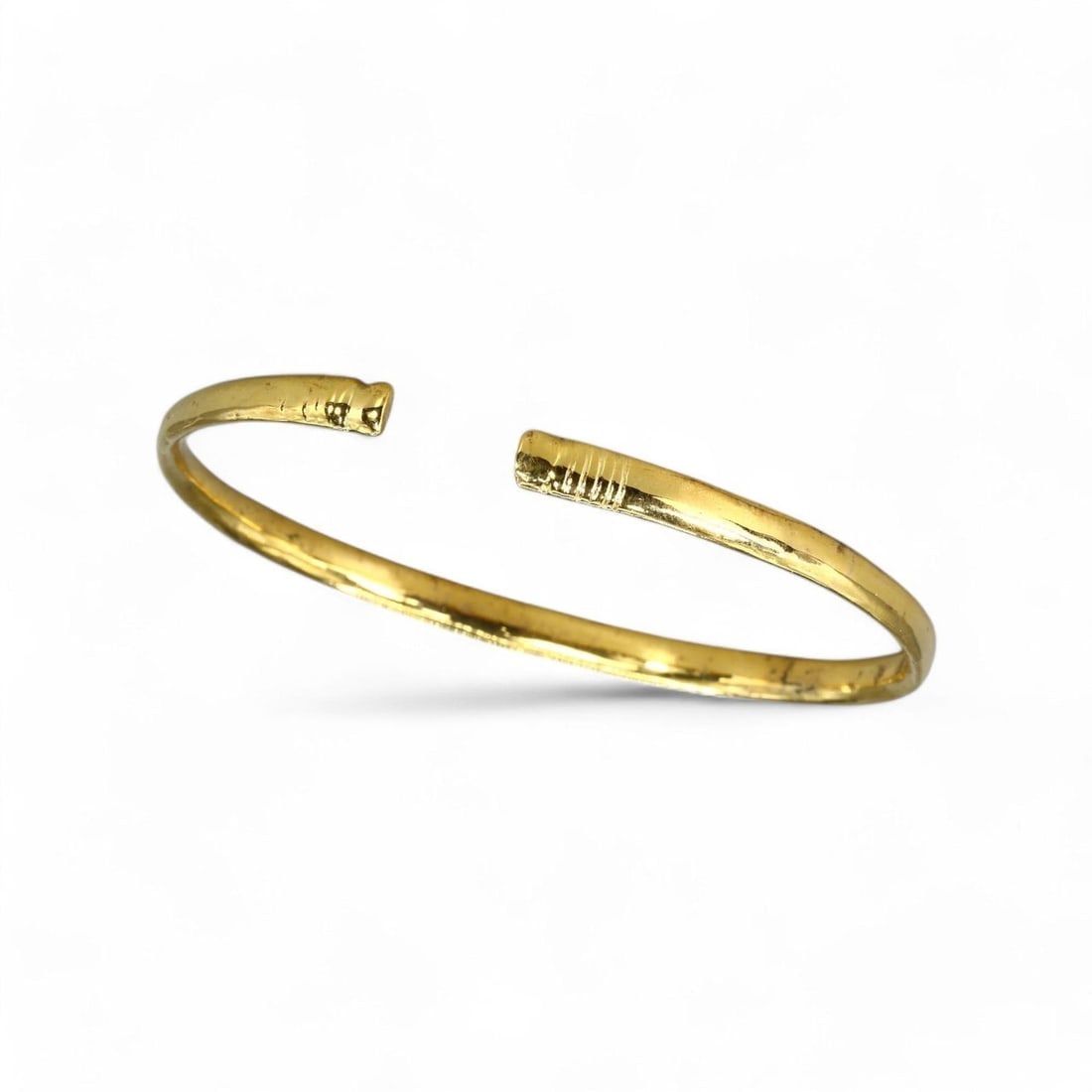 VIKING AGE: Gold-Gilt Armlet Bracelet, 12g, 6.5cm, 24k Gold Gilt: This remarkable Viking armlet bracelet, weighing 12g and measuring 6.5cm in diameter, features a 24k gold gilt finish, embodying the sophistication and functionality of Norse jewelry. Its open-ended d