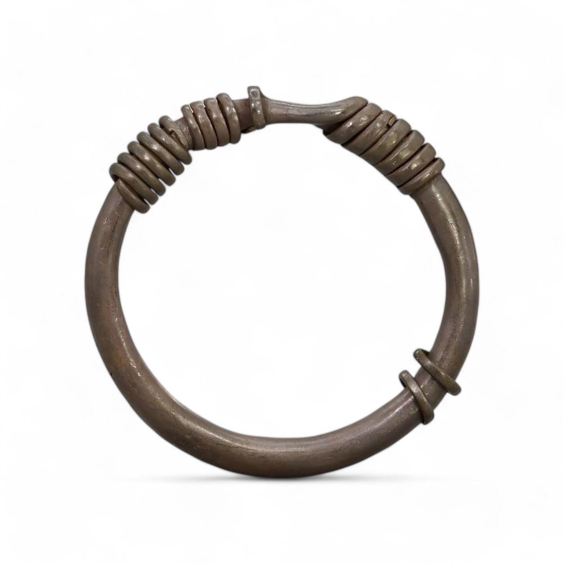 Antique: Miao-Wuya Bronze Bracelet, China (ca. 11000) (101g, 1x6.5cm): This antique bronze bracelet, originating from the Miao-Wuya people of China around 11000, showcases a minimalist yet distinctive design. The coiled embellishments and sleek, rounded band reflect trad