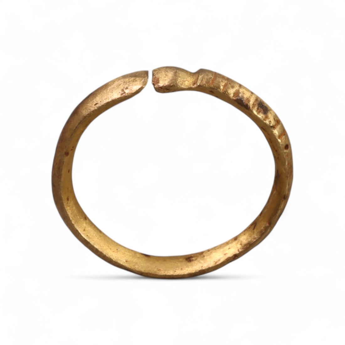 VIKING ERA: Bronze Serpent-Motif Ring, Circa 9th-11th Century CE (5g, 3cm Diameter): This Viking-era bronze ring features a subtle serpent motif, symbolizing wisdom, protection, and transformation in Norse mythology. The open-ended design, with engraved detailing along the band, refle