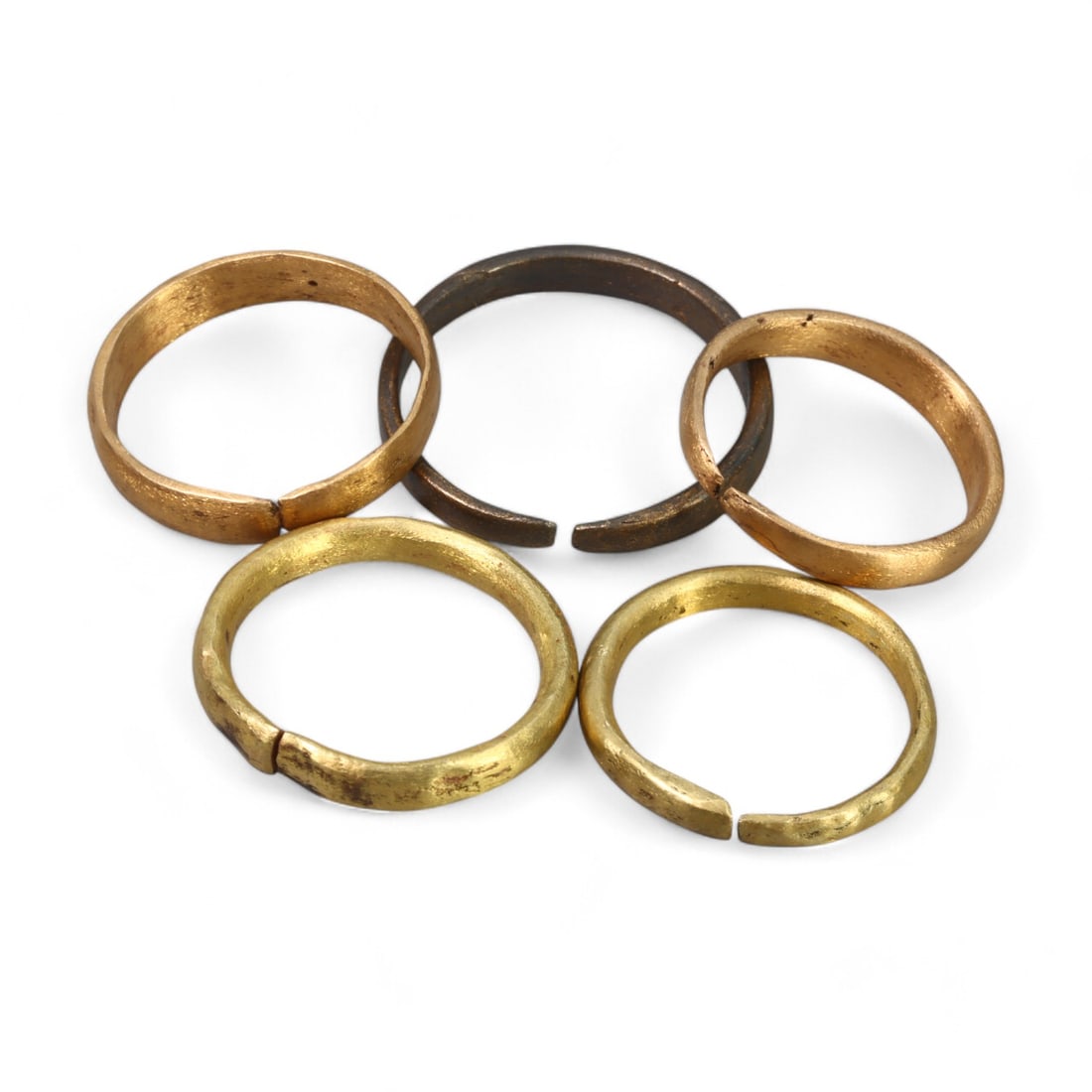 VIKING ERA: Set of Proto-Rings, Circa 9th-11th Century CE (19g, 2-2.5cm, 5 Pieces): This fascinating collection of five Viking-era proto-rings showcases the practical and versatile design of Norse craftsmanship. Each ring, cast in bronze and adorned with gold-gilt highlights, demonst