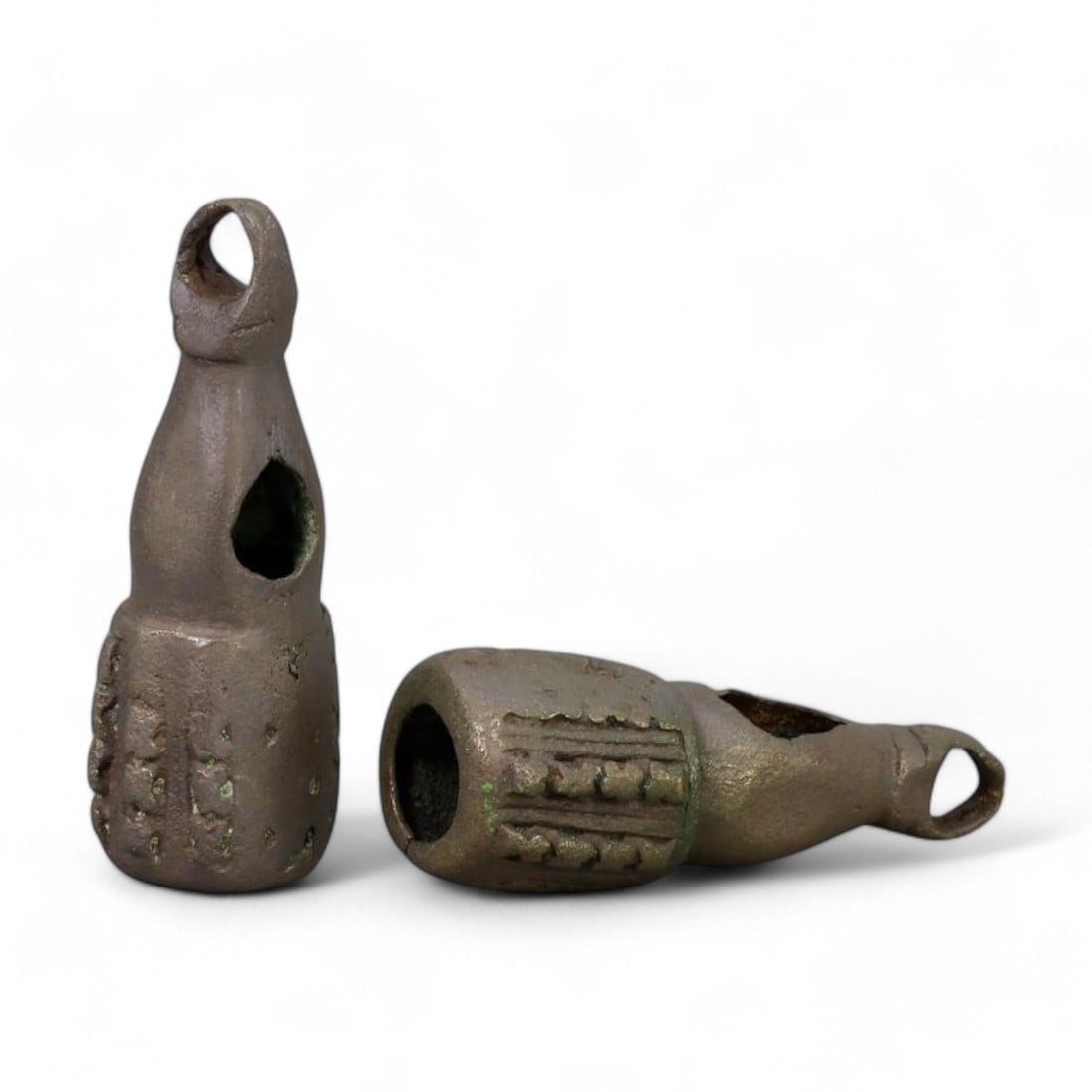 WEST AFRICAN: Pair of Bell-Shaped Currency Ornaments, 19th-20th Century CE (48g, 5.5cm each): This pair of bell-shaped currency ornaments, crafted from bronze, exemplifies the dual role of such objects in West African cultures: as both a medium of trade and a symbol of status or wealth. The in