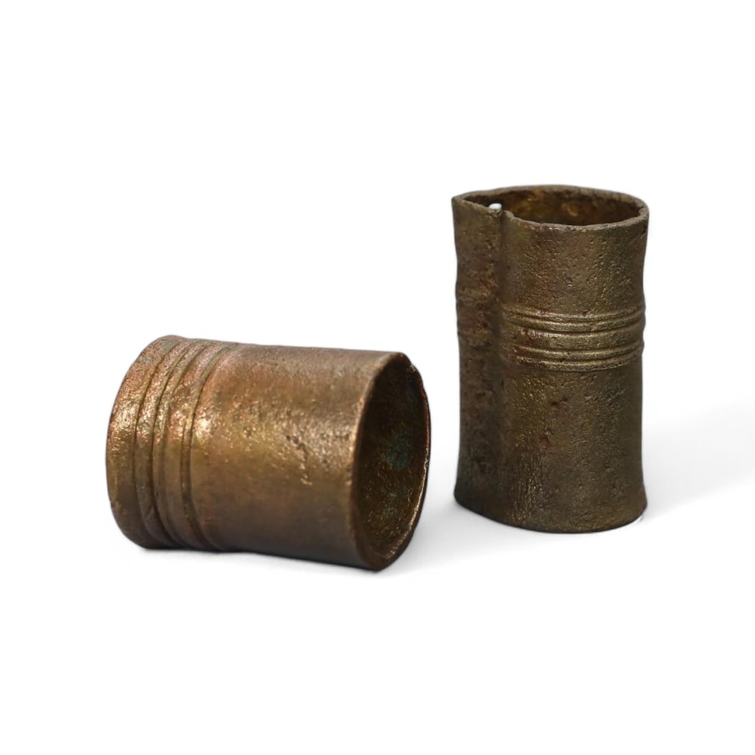 ANCIENT BRONZE PROTO-CURRENCY: Tubular Ingots, Circa 1st Millennium BCE (30g, 2.5-3cm): This pair of ancient bronze proto-currency ingots, each measuring between 2.5 and 3 cm and weighing approximately 30g combined, exemplify an early form of standardized trade medium used in ancient eco