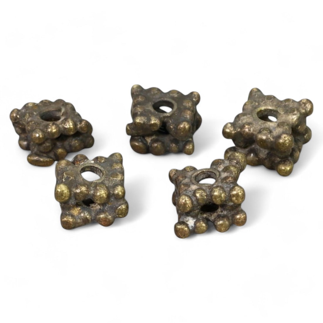 VIKING PSEUDO-GRANULATION SILVER BEADS: Set of 5, Circa 9th - 11th Century CE (0.4cm Each, 1.94g): This set of five Viking-era beads showcases the pseudo-granulation technique, with cube-shaped designs adorned with raised circular motifs. Measuring 0.4cm each and possibly crafted from silver or hac