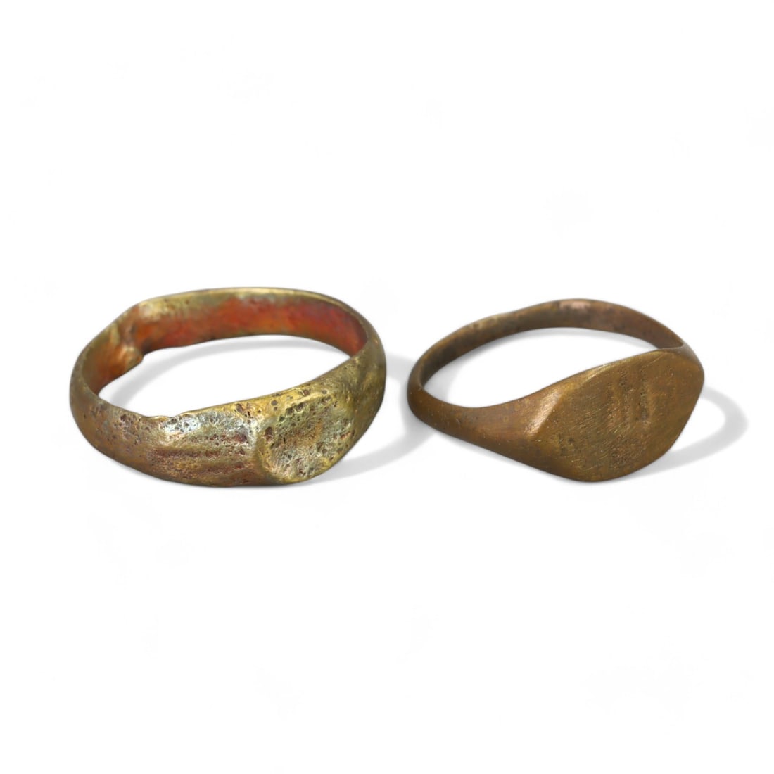 CRUSADER ERA: Bronze Oval Signet Rings, 12th-14th Century CE (Sizes 2-3 US, 2g, Lot of 2): This pair of petite Crusader-era bronze signet rings features simple, oval bezels, reflecting the utilitarian elegance of medieval craftsmanship. Likely intended for smaller hands or as tokens of pers