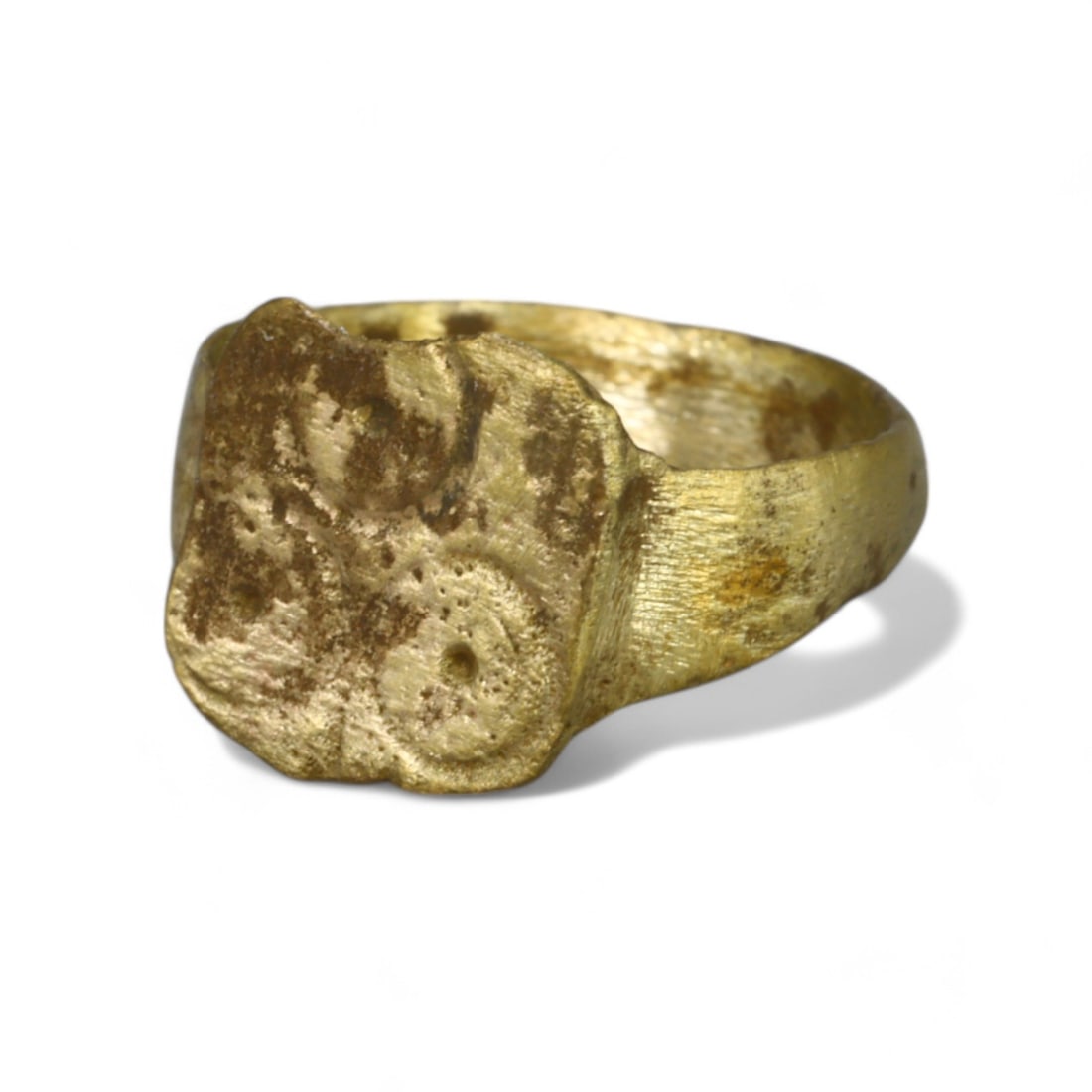 BYZANTINE ERA: Gold Gilt "Irregular Square Bezel" Ring, 6th-8th Century CE (1.3 cm Diameter, 1g): This Byzantine-era ring, crafted from bronze with a luxurious gold gilt finish, features an irregularly shaped square bezel adorned with faint decorative patterns. The unique bezel shape and lightweig