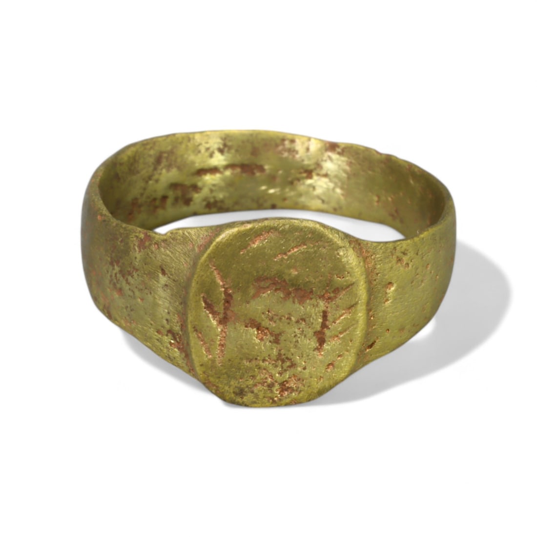 BYZANTINE ERA: Gold Gilt "Wide Oval Bezel" Ring, 6th-8th Century CE (Size 6 US, 2.7g): This impressive Byzantine-era ring, crafted from bronze and gilded with a luminous gold finish, features a wide band and a prominent oval bezel with faint decorative traces. The sturdy construction an