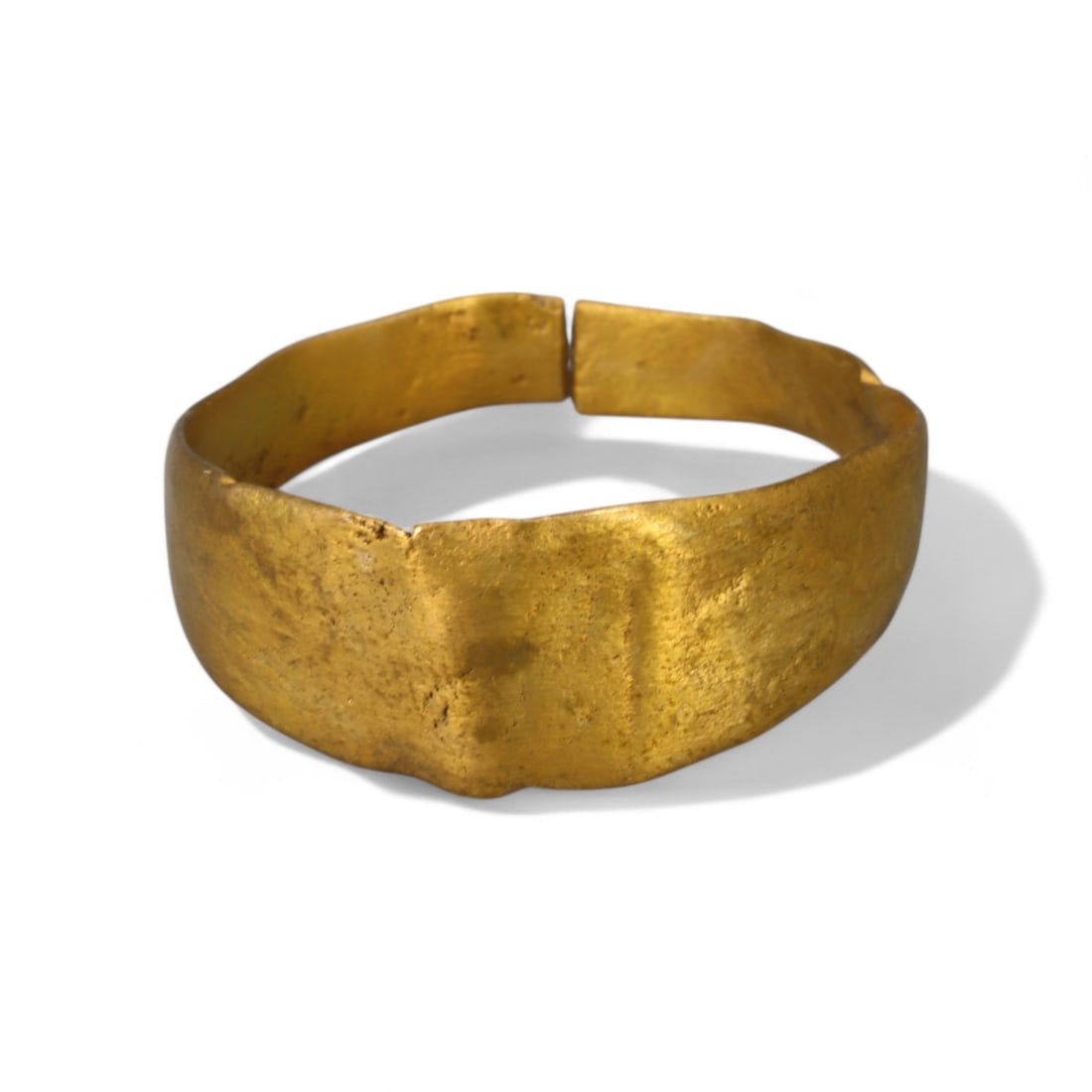 BYZANTINE ERA: Gilded Bronze "Minimalist Band" Ring, 6th-9th Century CE (Size 10 US, 3g): This Byzantine-era gilded bronze ring features a sleek, minimalist band design, reflecting the understated elegance characteristic of the period. The smooth and wide surface showcases the mastery of B