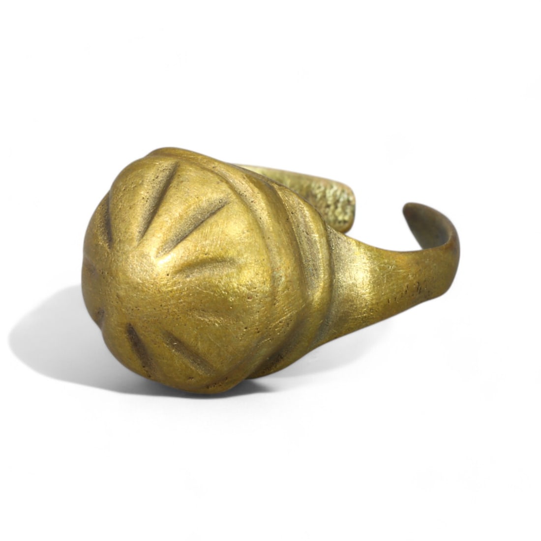 BYZANTINE ERA: Gilded Bronze "Domed Starburst" Ring, 6th-9th Century CE (Diameter: 2 cm, 5g): This impressive Byzantine-era gilded bronze ring features a domed bezel with engraved starburst patterns radiating outward, a motif often associated with divine guidance and heavenly light. The open c