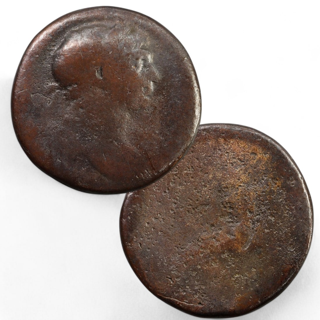 ROMAN EMPIRE: AE As Coin of Trajan, 98-117 CE (9g, 25mm): This bronze As from the reign of Trajan (r. 98-117 CE) is a testament to the stability and prosperity achieved during his rule. The obverse features a right-facing bust of Trajan, his stern profile em