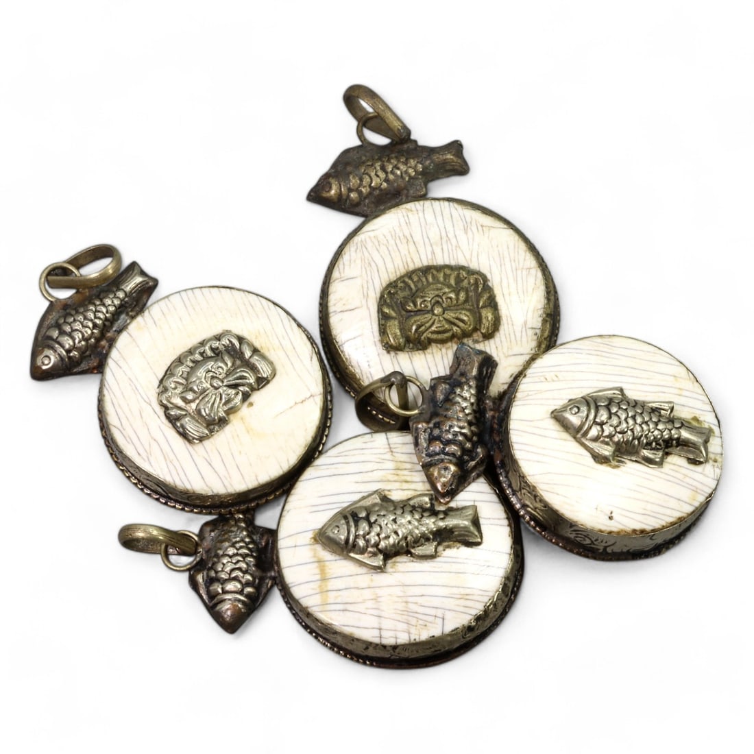 HIMALAYAN REGION: Carved Bone Amulets with Silver Fish and Mask Motifs,17th-19th CE (62g, 4.5x3.5cm): This set of intricately carved bone amulets features silver adornments in the form of symbolic fish and protective mask motifs. Each amulet measures 4.5x3.5 cm and weighs a total of 62g for the set. T