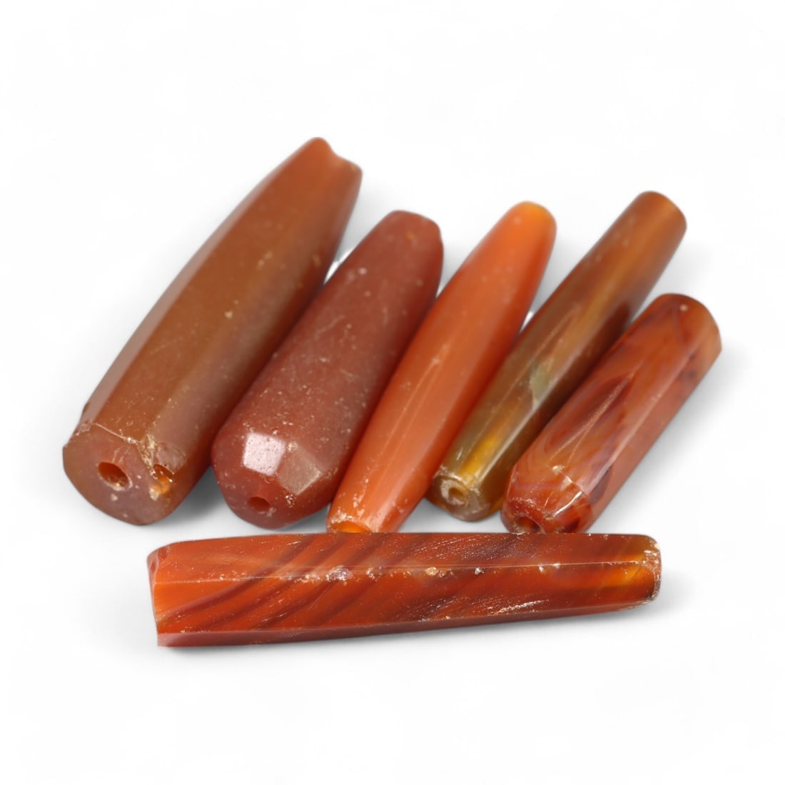 ANTIQUE CARNELIAN BEADS: Faceted and Cylindrical Beads, Idar-Oberstein, 19th Century (63g, 51x15mm): This remarkable set of six antique carnelian beads exhibits exquisite craftsmanship attributed to Idar-Oberstein, Germany, a historic center for gemstone cutting. Each bead, measuring 51x15mm, feature