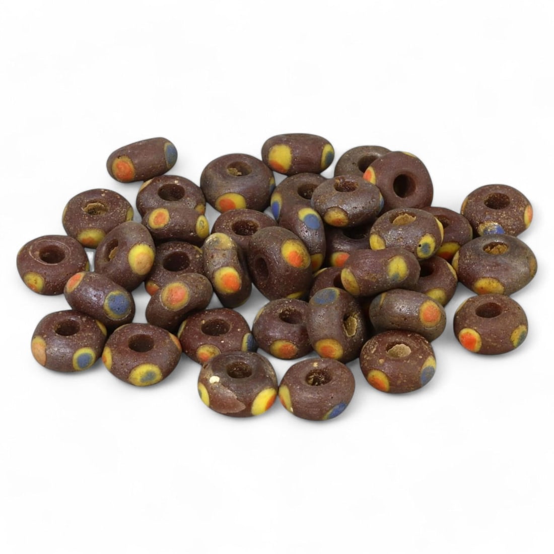 MEDIEVAL MEDITERRANEAN POLYCHROME GLASS BEADS: Circa 9th-15th Century CE (1cm, 19g): This collection consists of intricately crafted polychrome glass beads, each measuring nearly 1cm. Likely originating from the medieval Mediterranean region, the beads display a rich base color adorne
