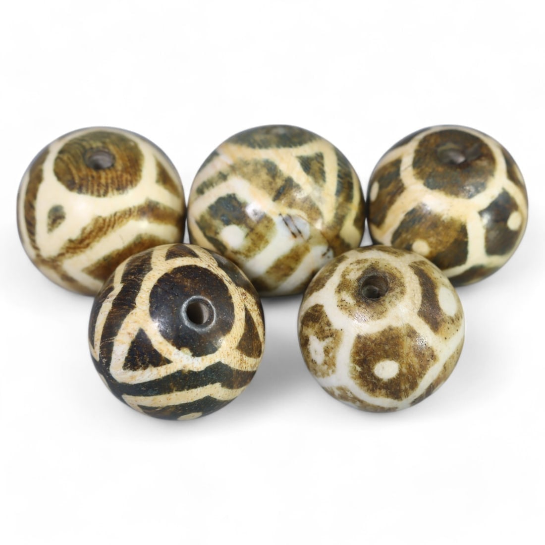 PYU-STYLE TIBETAN ETCHED PUNTEK WOOD BEADS: Lot of Antique Beads, 27g, 17-18mm: This exceptional lot contains 27g of Pyu-style Tibetan etched Puntek wood beads, each measuring 17-18mm. These beads are characterized by their intricate geometric and circular etched designs, created