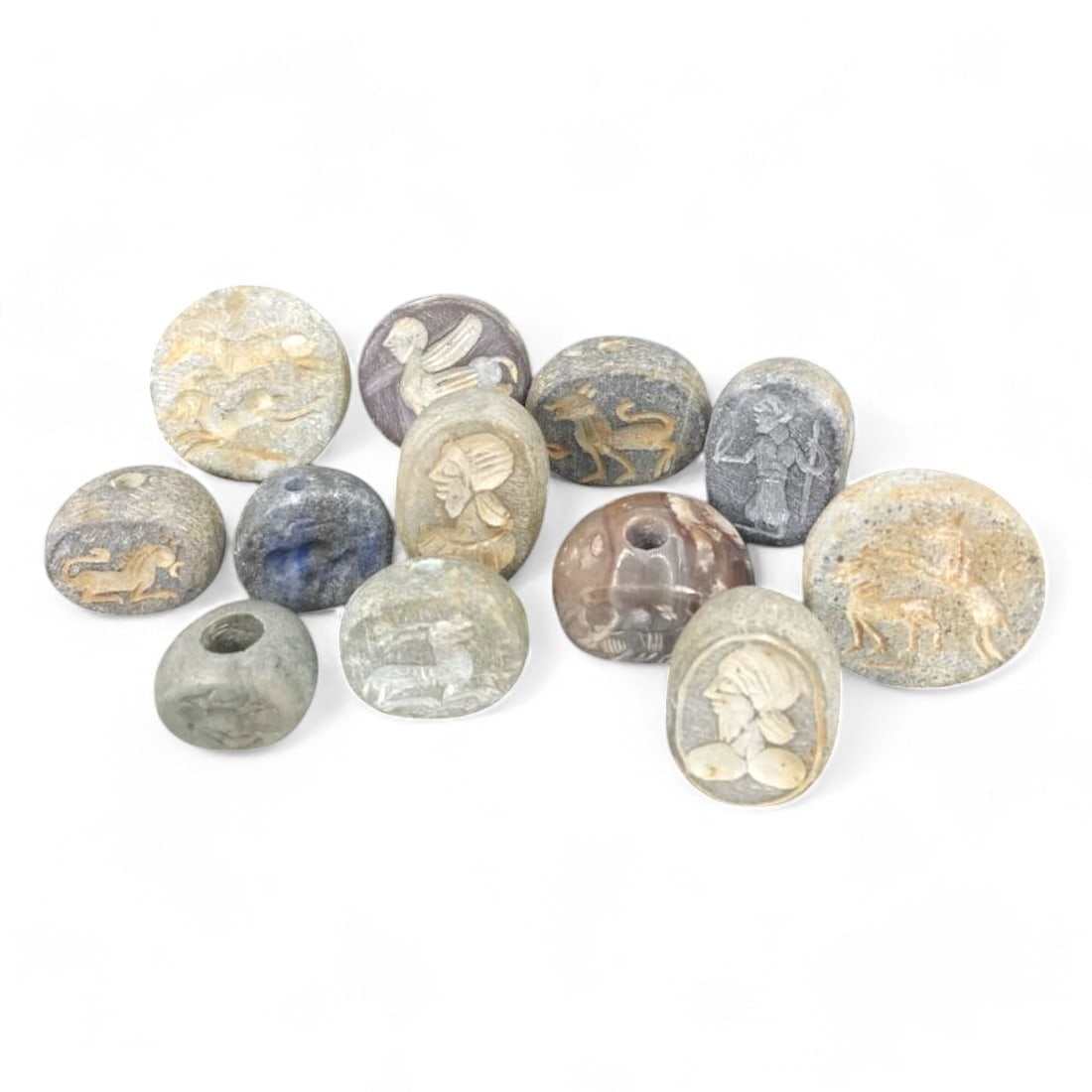 POST-MEDIEVAL PERSIAN STYLE: Lot of 12 Agate Intaglio Seal Beads, 19th-20th Century CE (149g,: This exquisite lot features agate seal beads, intricately carved in the Persian intaglio style, dating to the 19th-20th century CE. The beads, showcase finely detailed motifs such as profiles of figur