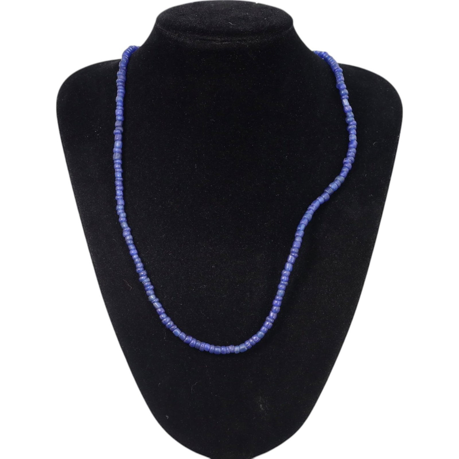 ANCIENT MEDITERRANEAN: Lapis Lazuli Bead Necklace, c. 2nd Millennium BCE (20g, 60cm): This elegant necklace features a sequence of hand-carved lapis lazuli beads, celebrated for their rich blue hue with subtle natural inclusions. Weighing 20 grams and extending to a length of 60 cm, th