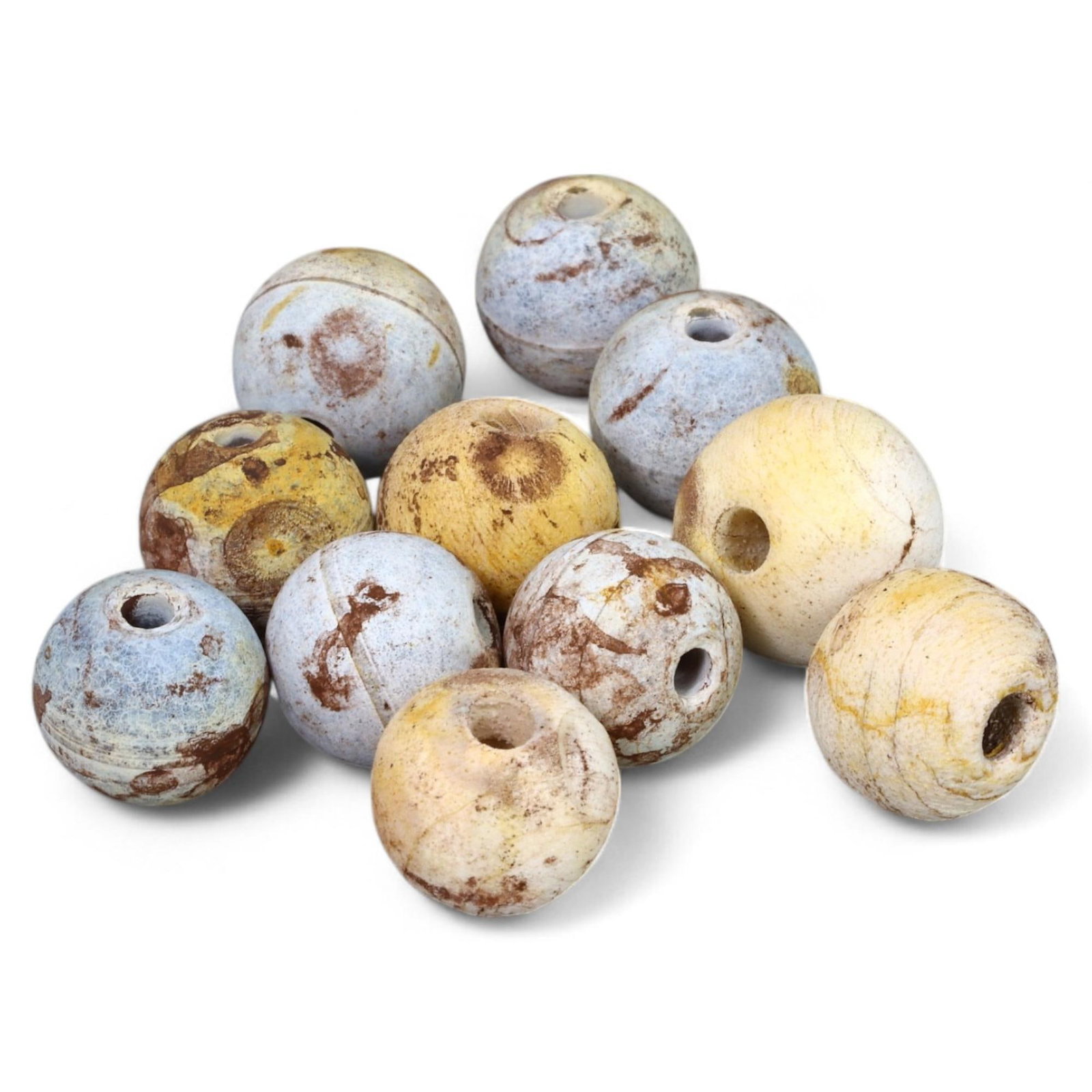 ANCIENT: Lot of 11 Round Stone Beads, Likely Late Bronze Age to Early Iron Age (6-8 mm, 13g Total): This lot includes 11 spherical stone beads, each meticulously crafted with central perforations for stringing. These beads display a vibrant mix of natural hues, including pale blues, yellows, and bro