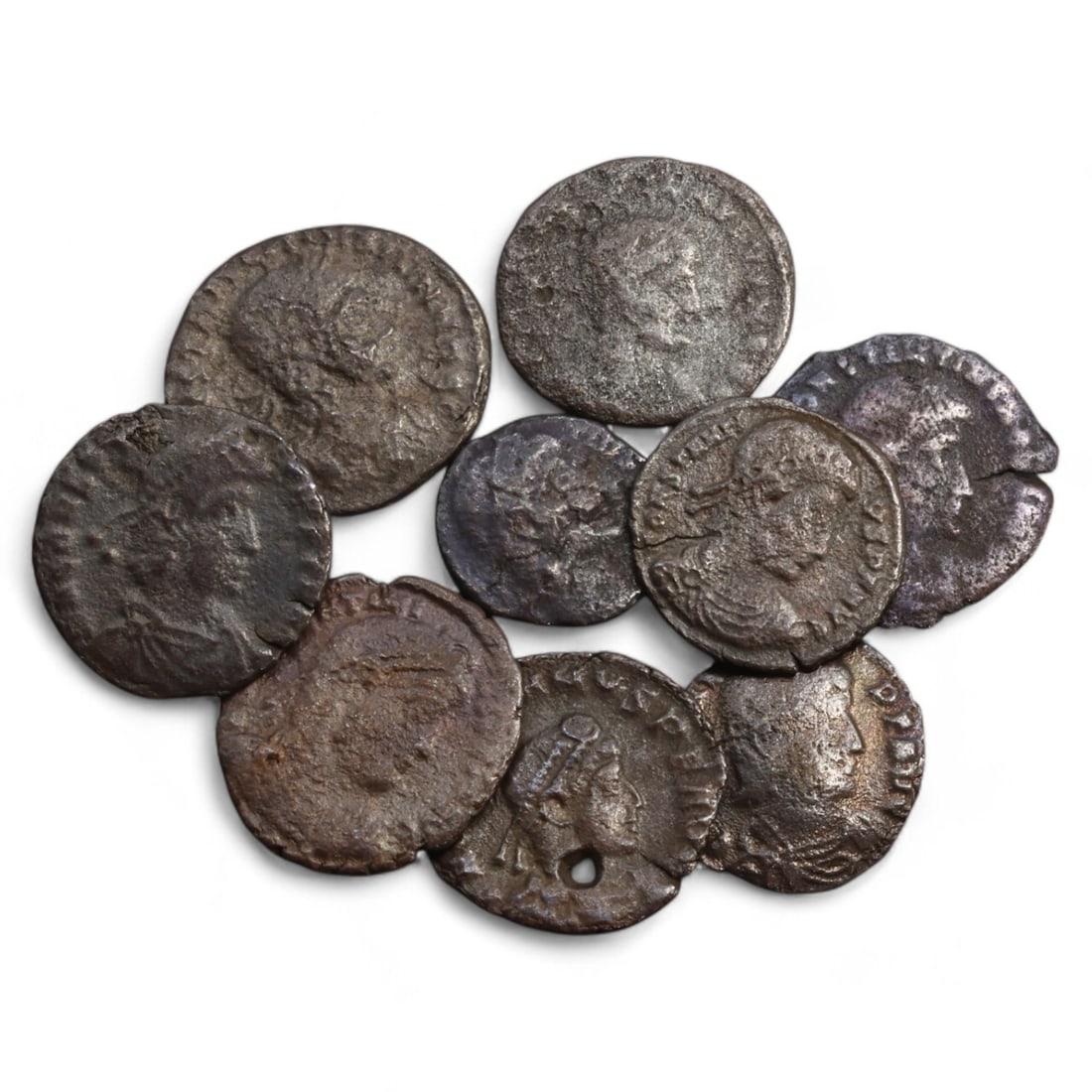 ROMAN EMPIRE: Lot of 9 AE Coins, Late Imperial Period, 15g, 12-18mm: This collection includes nine bronze coins from the late Roman Empire, the obverses feature various portraits of Roman emperors and notable figures, emphasizing the diversity of imperial iconography d