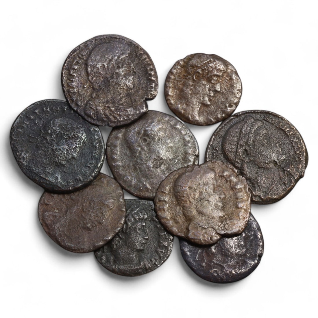 ROMAN EMPIRE: Lot of 9 AE Coins, Late Imperial Period, 15g, 15-18mm: This collection includes nine bronze coins from the late Roman Empire, the obverses feature various portraits of Roman emperors and notable figures, emphasizing the diversity of imperial iconography d