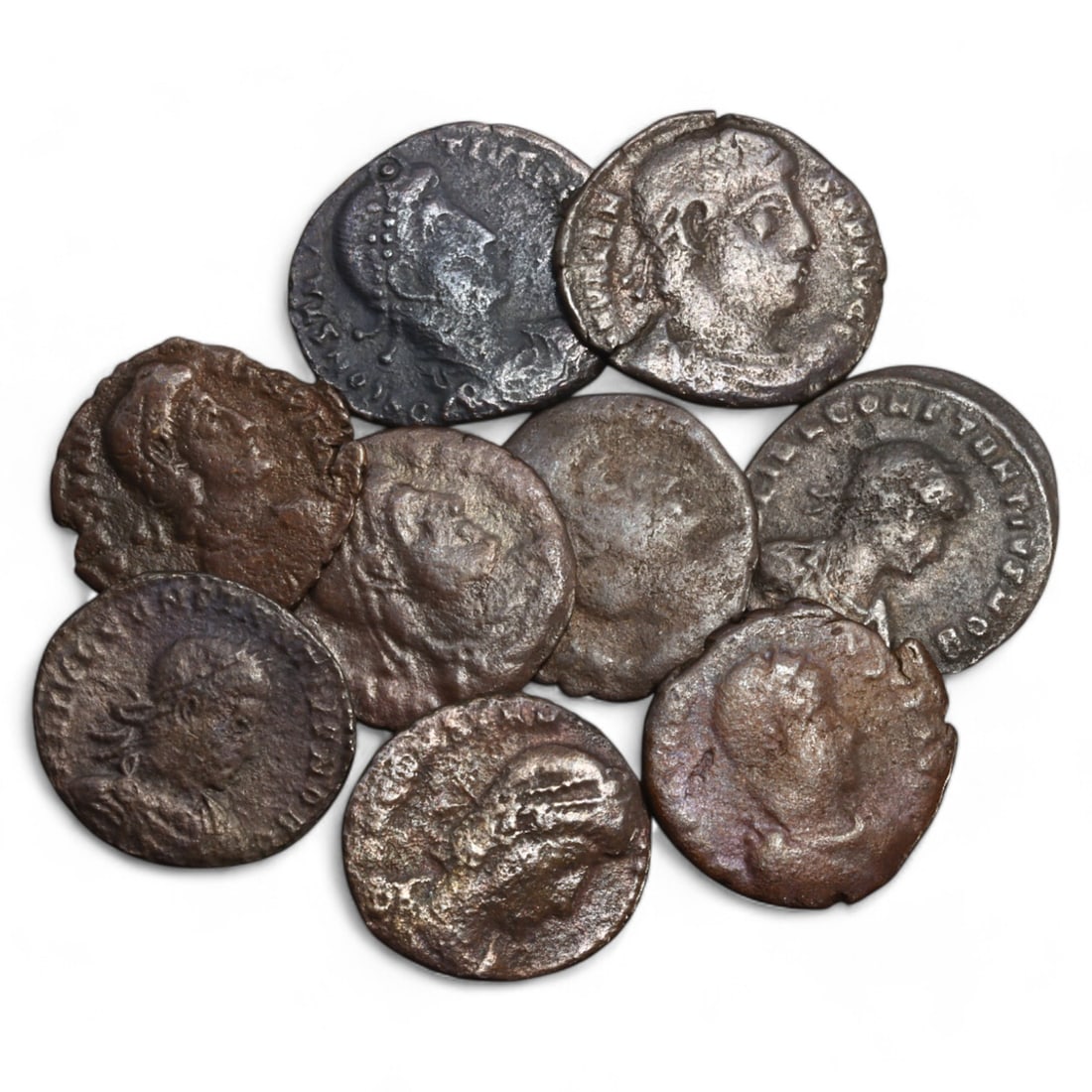 ROMAN EMPIRE: Lot of 9 AE Coins, Late Imperial Period, 15g, 16-19mm: This collection includes nine bronze coins from the late Roman Empire, the obverses feature various portraits of Roman emperors and notable figures, emphasizing the diversity of imperial iconography d
