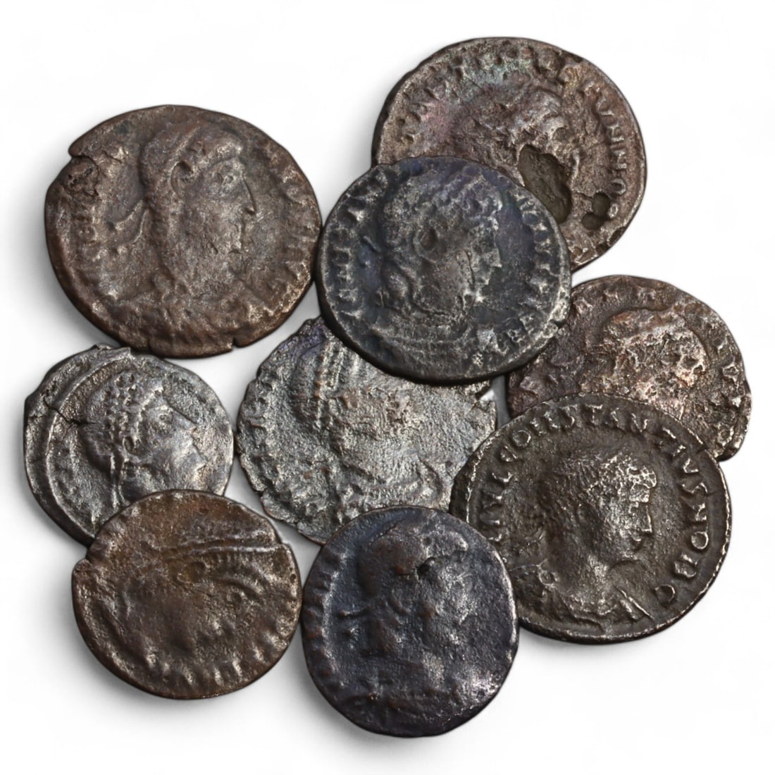 ROMAN EMPIRE: Lot of 9 AE Coins, Late Imperial Period, 12g, 14-19mm: This collection includes nine bronze coins from the late Roman Empire, the obverses feature various portraits of Roman emperors and notable figures, emphasizing the diversity of imperial iconography d
