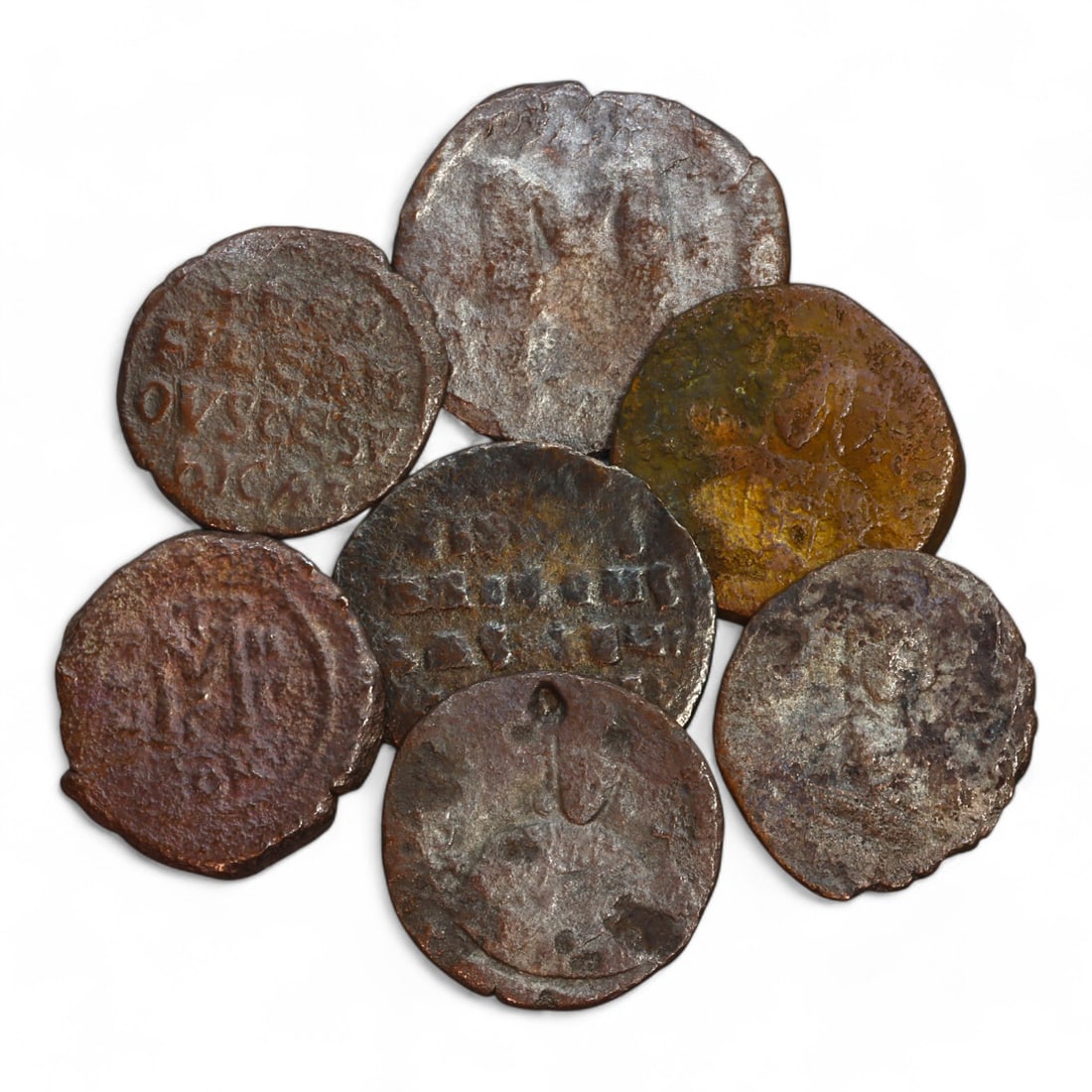 BYZANTINE EMPIRE: Lot of 7 Large Bronze Follis Coins, 6th-7th Century CE (60g Total, 30-33mm): This lot includes 7 large bronze follis coins from the Byzantine Empire, collectively weighing 60 grams with diameters ranging from 30mm to 33mm. The obverse sides feature worn imperial busts or inscr