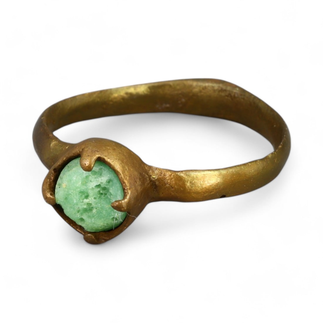 BYZANTINE ERA: Bronze "Green Gemstone Claw-Set" Ring, 6th-9th Century CE (Size 5 US, 2g): This remarkable Byzantine-era bronze ring showcases a central green gemstone securely held in a claw-like setting, a design reflecting both durability and aesthetic sophistication. The vibrant hue of 
