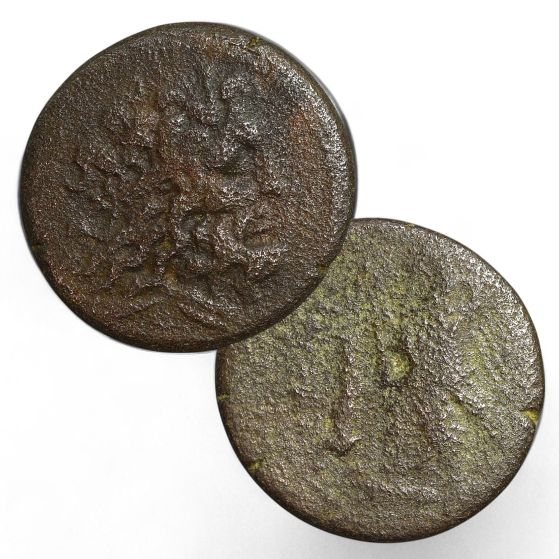 ROMAN PROVINCIAL: AE23 Bronze Coin (9g, 23mm): This medium-sized bronze coin features a worn obverse that likely depicted the bust of an emperor, deity, or regional figure. The reverse, also heavily weathered, might have displayed a symbolic motif