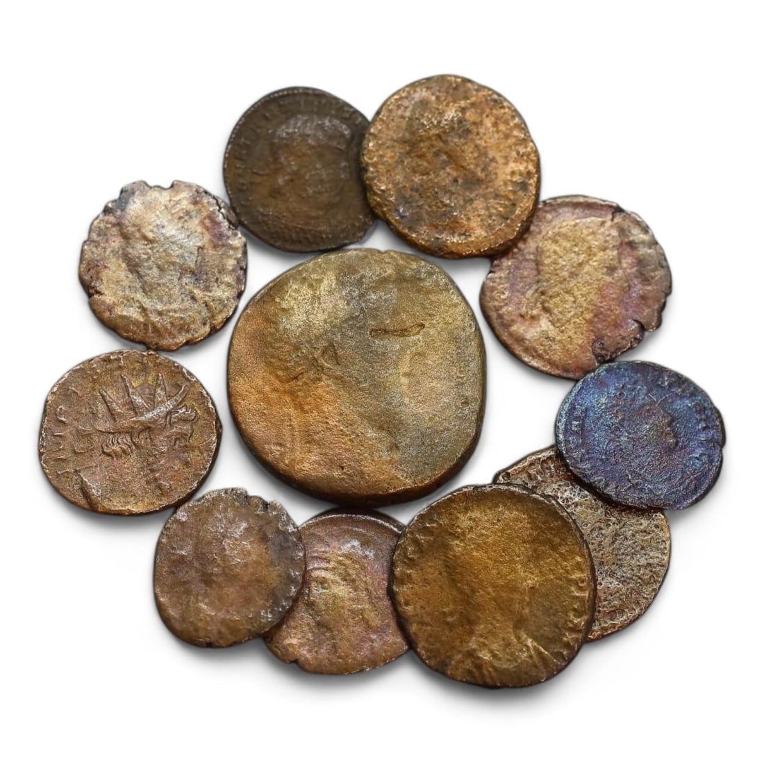ANCIENT ROMAN EMPIRE: Bronze Coin Lot, Circa 1st-4th Century CE (37g, 16-25mm, 11 Pieces): This collection of ancient Roman coins, offers a glimpse into the economic and cultural fabric of the Roman Empire. The coins feature a variety of designs, including imperial portraits, deities, and m