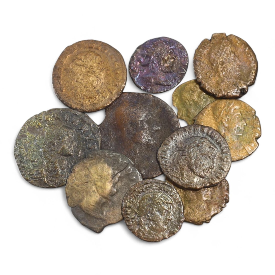 ANCIENT ROMAN EMPIRE: Bronze Coin Lot, Circa 1st-4th Century CE (21g, 15-32mm, 11 Pieces): This collection of ancient Roman coins, offers a glimpse into the economic and cultural fabric of the Roman Empire. The coins feature a variety of designs, including imperial portraits, deities, and m