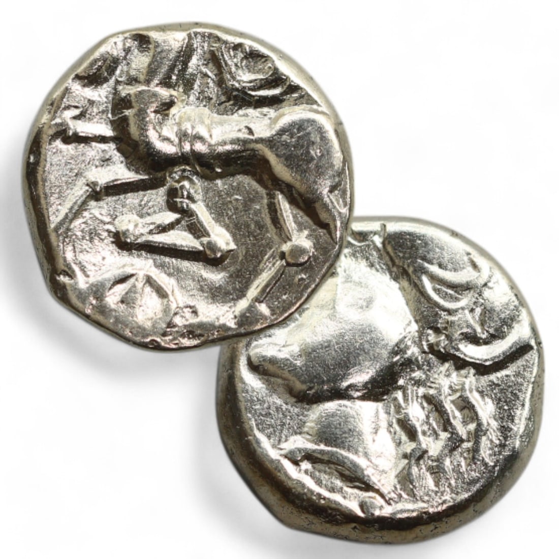 CELTIC ERA: Silver "Galloping Horse" Coin Amulet, Circa 1st Century BCE (1 cm, 1.9g): This tiny yet remarkable Celtic silver coin pendant depicts a galloping horse on its reverse, a dynamic representation of vitality and prestige in Celtic society. The horse, rendered in a stylized and