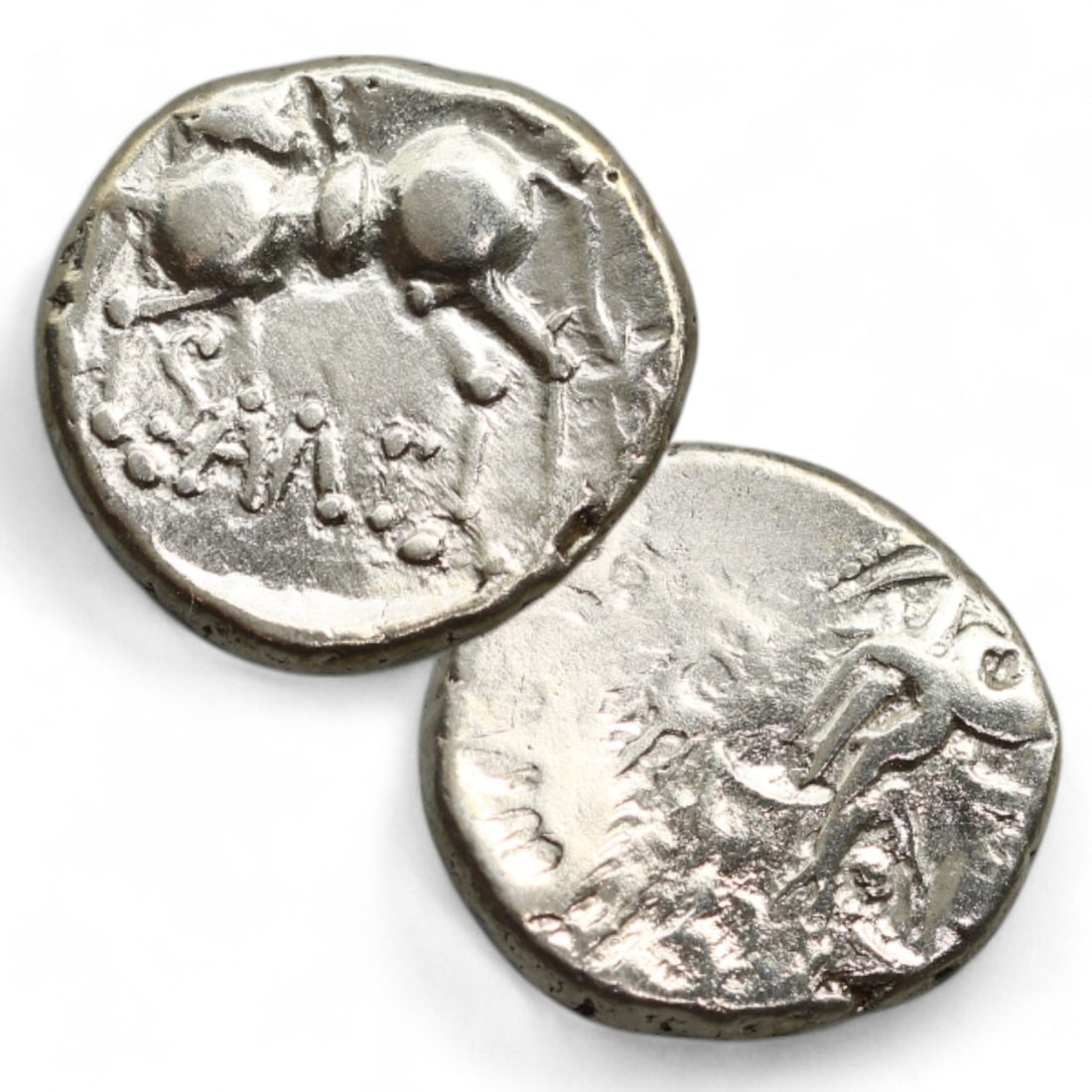 CELTIC ERA: Silver "Tribal Horse" Coin Pendant, Circa 1st Century BCE (1 cm, 1.8g): This intricately designed Celtic silver coin pendant showcases a tribal horse image on its reverse, a testament to the Celts' artistic and symbolic traditions. The horse, depicted with flowing lines a
