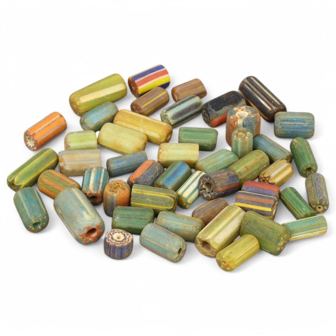 Antique Venetian: Glass Chevron Cylinder Beads, Murano Mastery (0.5-1.5 cm, 41g): This exquisite set of antique Venetian glass chevron cylinder beads represents the mastery of Murano glassmakers. Measuring 0.5 to 1.5 cm, these beads feature the iconic chevron pattern, created throu