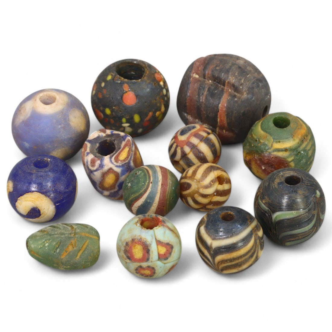 VENETIAN: Millefiori Glass Beads, (19g, 1cm): This stunning lot features a selection of Venetian millefiori glass beads, weighing 19 grams and measuring approximately 1 cm each. These beads are adorned with intricate multicolored floral and geome