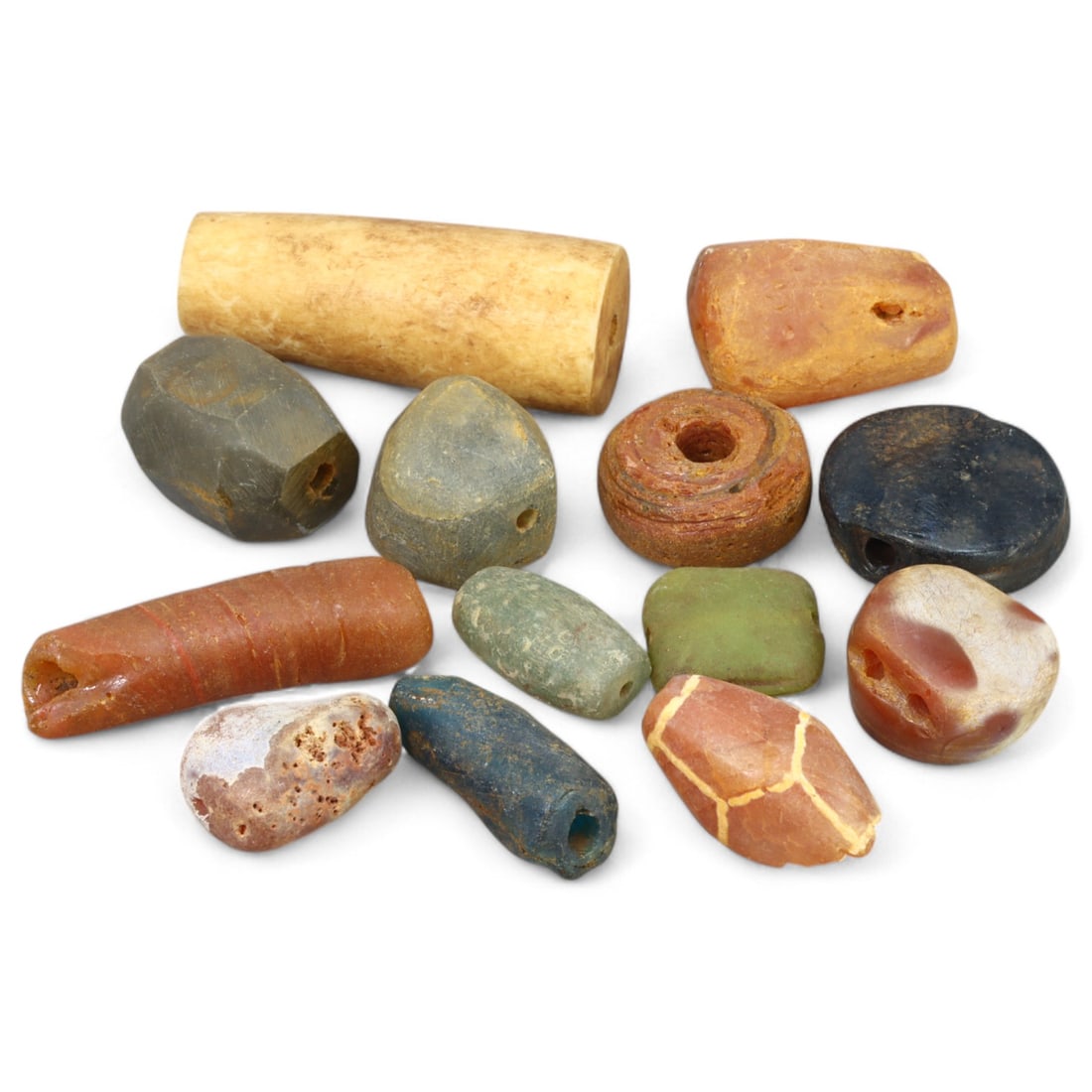ANCIENT NEAR EAST: Varied Stone Beads, (61g, 1-4cm): This captivating lot comprises ancient Near Eastern beads crafted from a variety of natural stones, weighing 61 grams and ranging in size from 1 to 4 cm. Each bead showcases unique hues and textures,