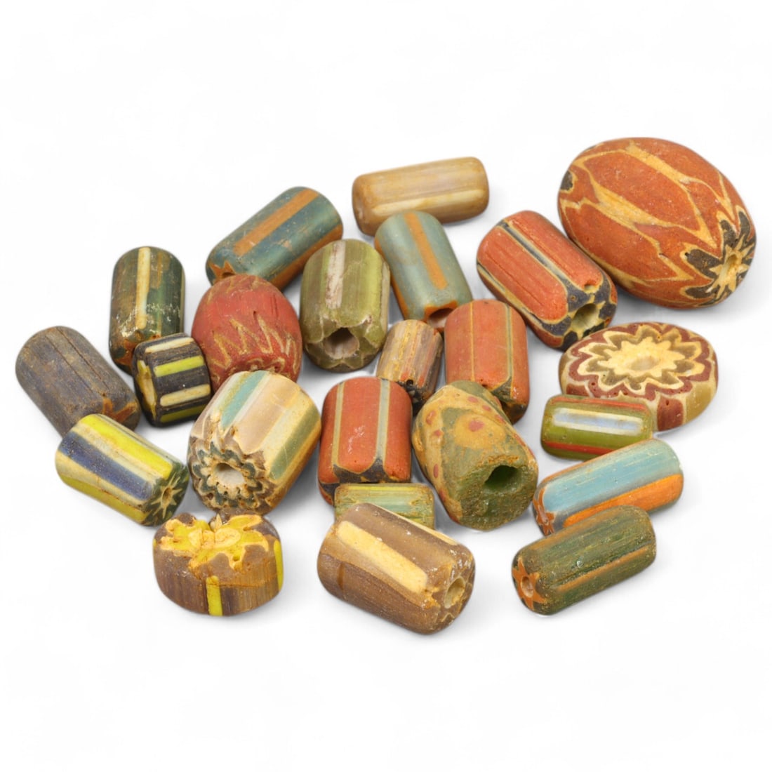 VENETIAN: Chevron Glass Trade Beads, (56g, 1-2cm): This exceptional lot features a collection of Venetian chevron glass trade beads, weighing 56 grams and ranging from 1 to 2 cm in size. Renowned for their intricate multi-layered starburst patterns an