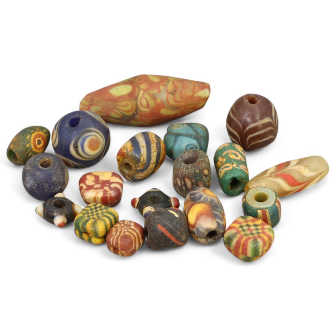 VENETIAN: Millefiori Glass Trade Beads, (24g, 1-2cm): This vibrant lot includes a selection of Venetian millefiori glass trade beads, totaling 24 grams and ranging from 1 to 2 cm in size. Renowned for their colorful and intricate floral and geometric pat