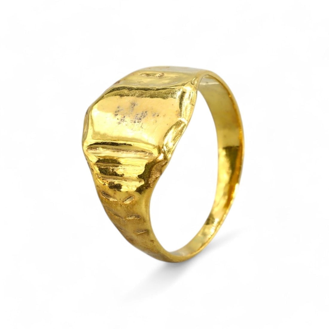 ROMAN EMPIRE: Bronze Ring with 24K Gold Gilt, 1st-3rd Century CE (4g, US Size 7): This Roman bronze ring, lavishly gilded in 24K gold, features a prominent rectangular bezel complemented by subtle engraved accents along the band. Such rings were not only statements of wealth and st