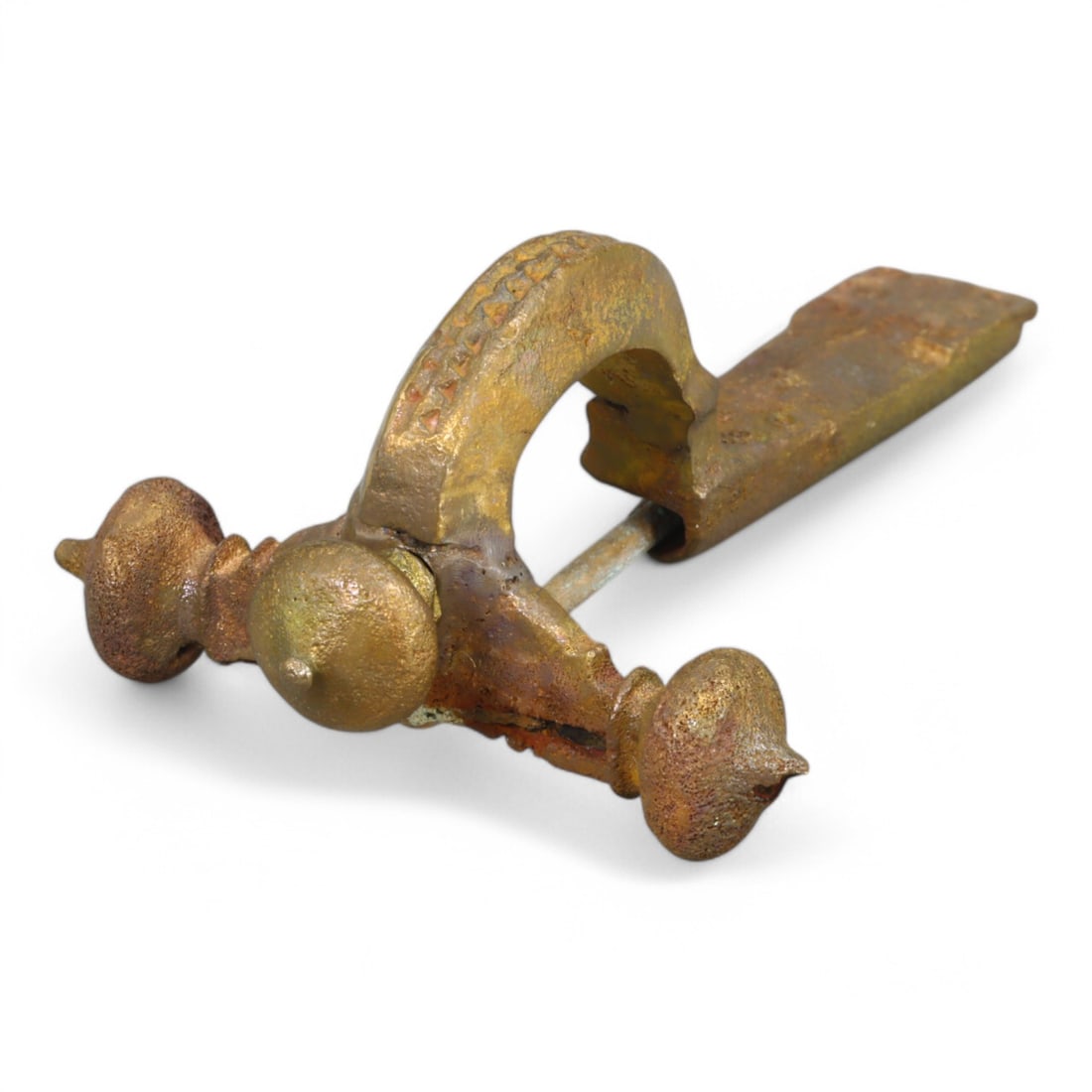 ROMAN GILT BRONZE FIBULA: Ornate Bow with Knobbed Crossbar and Gilded Finish (43g, 8cm): This striking Roman gilt bronze fibula showcases a curved bow adorned with intricate detailing, culminating in a wide, perforated footplate and a knobbed crossbar. The design reflects the fusion of fu