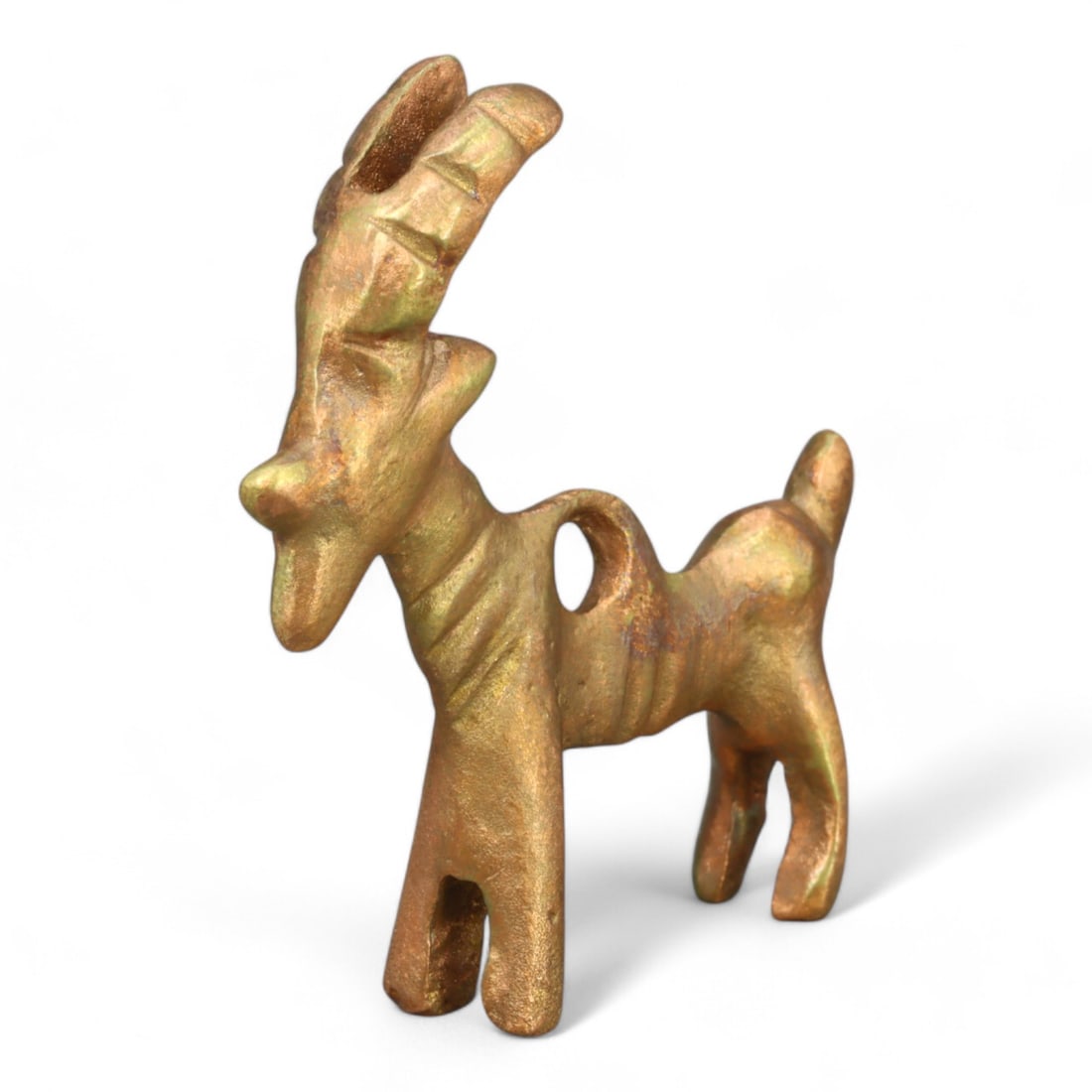 MONGOLIAN GOLD-GILT GAZELLE AMULET: Intricately Designed Pendant (22g, 4cm): This gold-gilt Mongolian amulet represents a gazelle, a symbol of agility, freedom, and resilience in regional culture. The amulet features a suspension hole, indicative of its use as a pendant or tal